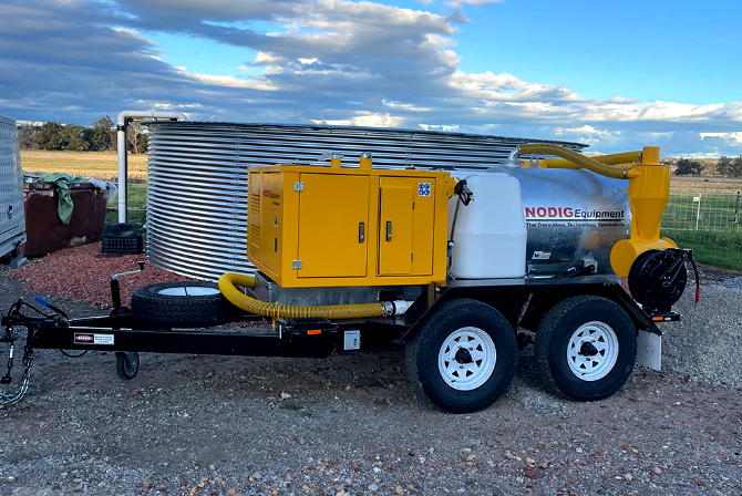 2022 No Dig VM850 compact vacuum excavator trailer-mounted unit showing yellow powerpack, 850L tilting spoil tank, and clean water tank on worksite