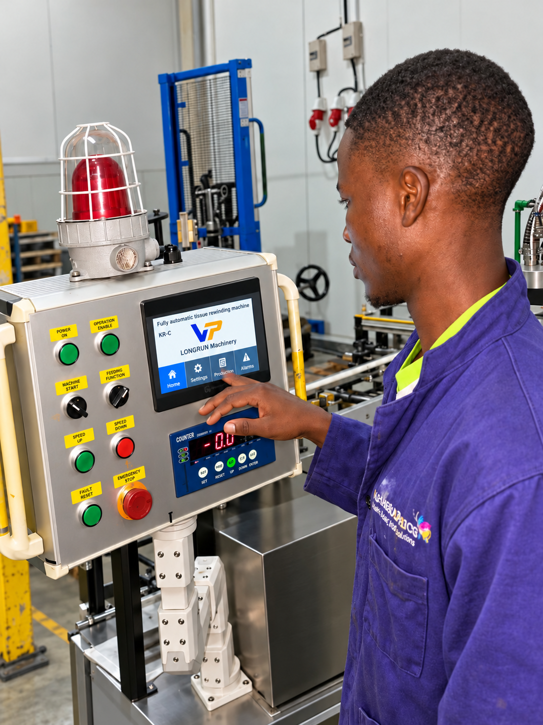 Fahagraphics technician operating the Longrun Machinery control panel and digital display in the pressroom