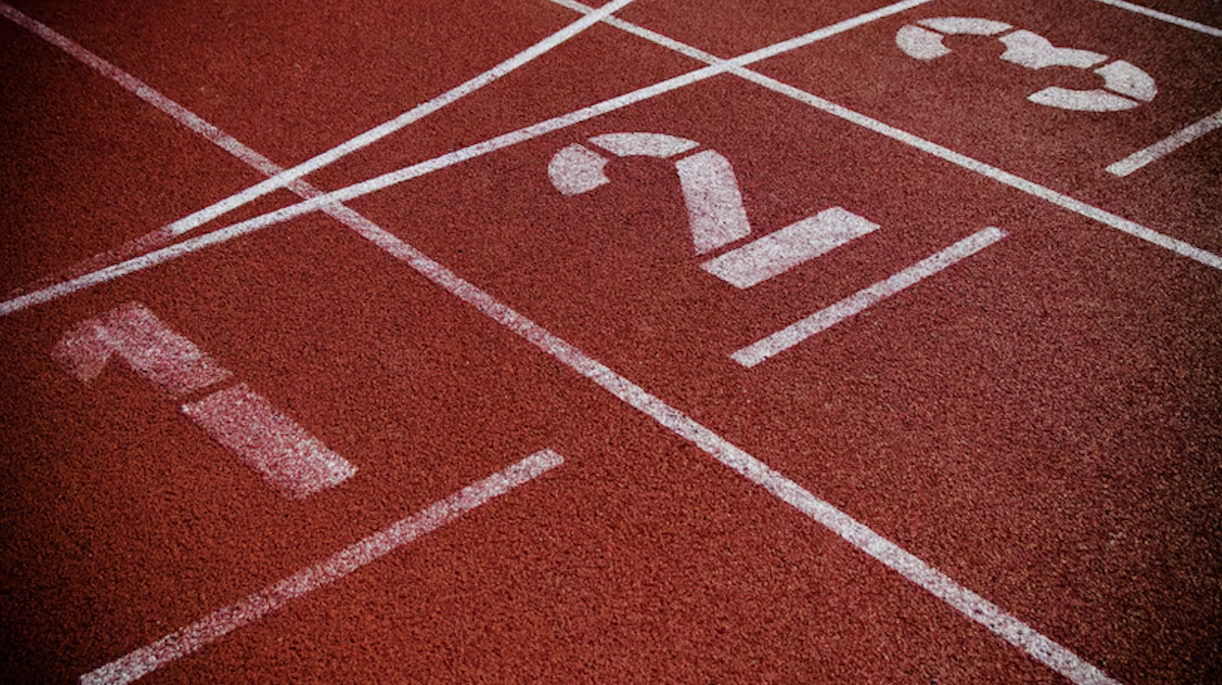 Track starting line numbered lanes 1, 2, 3