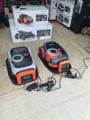 Segway Navimow robotic lawnmowers on charging stations at RM Lawnmowers, Meath