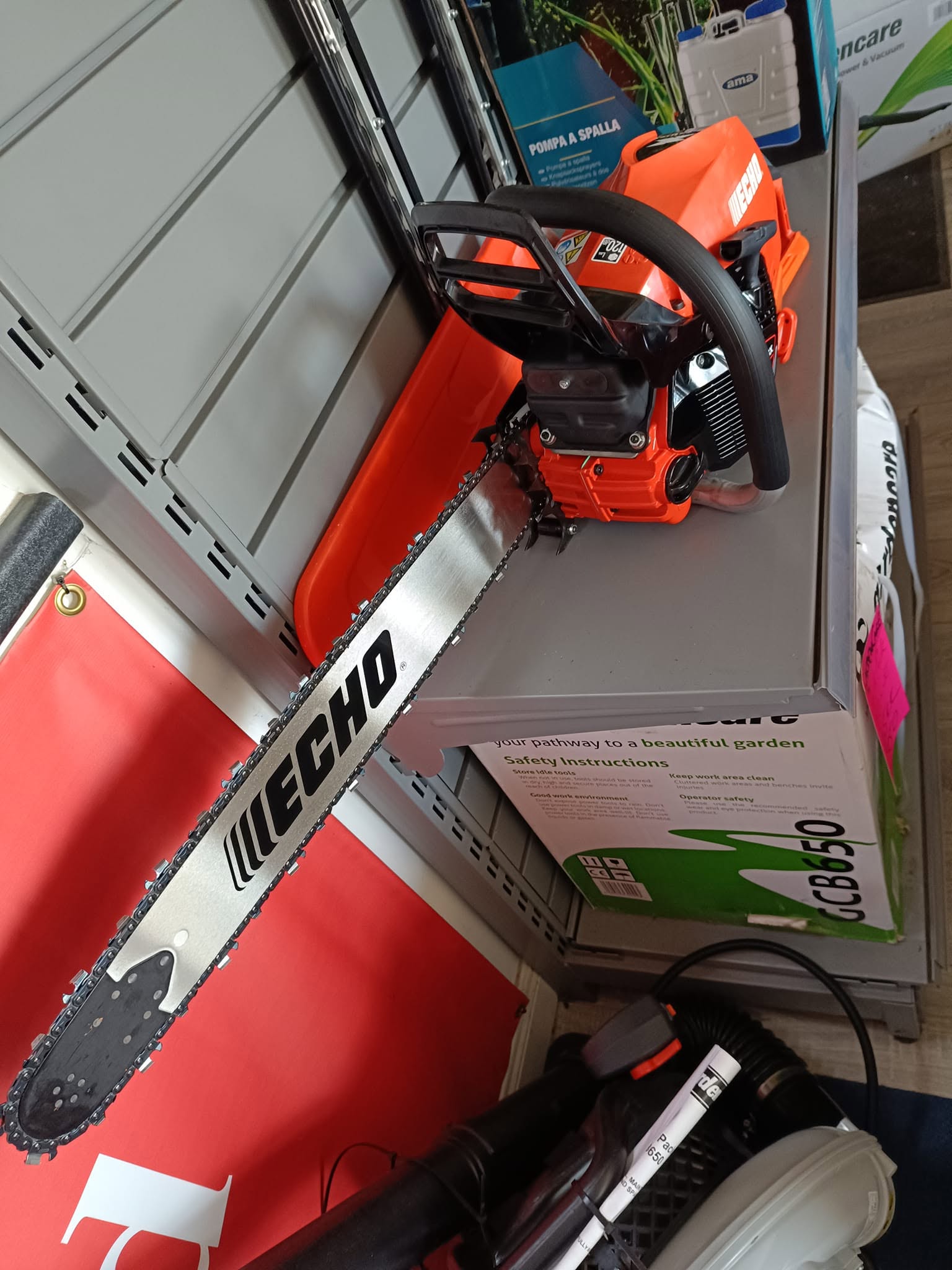 Echo professional petrol chainsaw with precision bar and chain on display