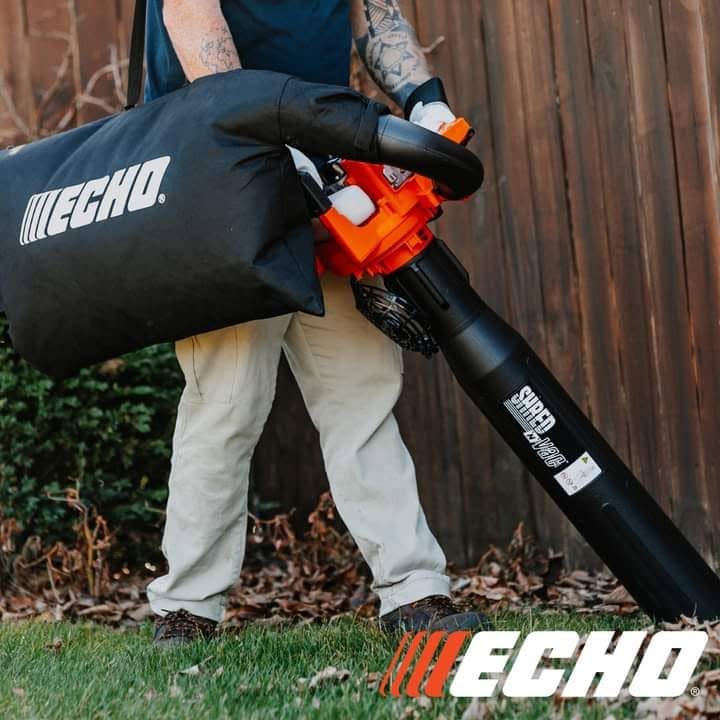 Echo Shred 'N' Vac garden vacuum and shredder in action clearing leaves