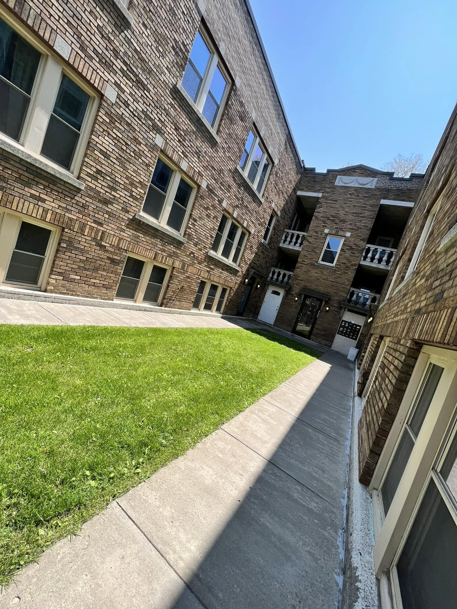 56-unit brick apartment building on North Winton