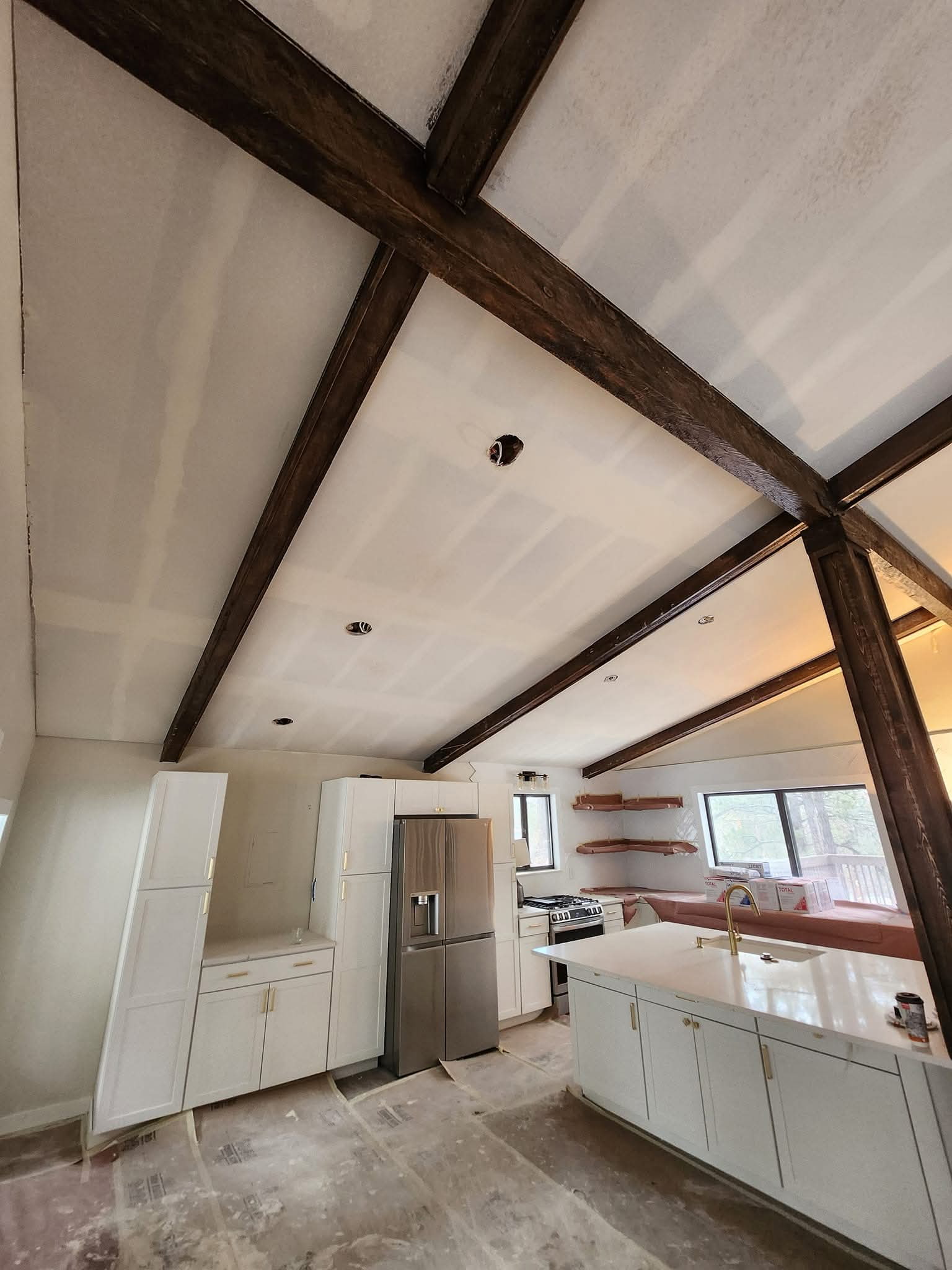 Kitchen drywall and vaulted ceiling timber beams renovation