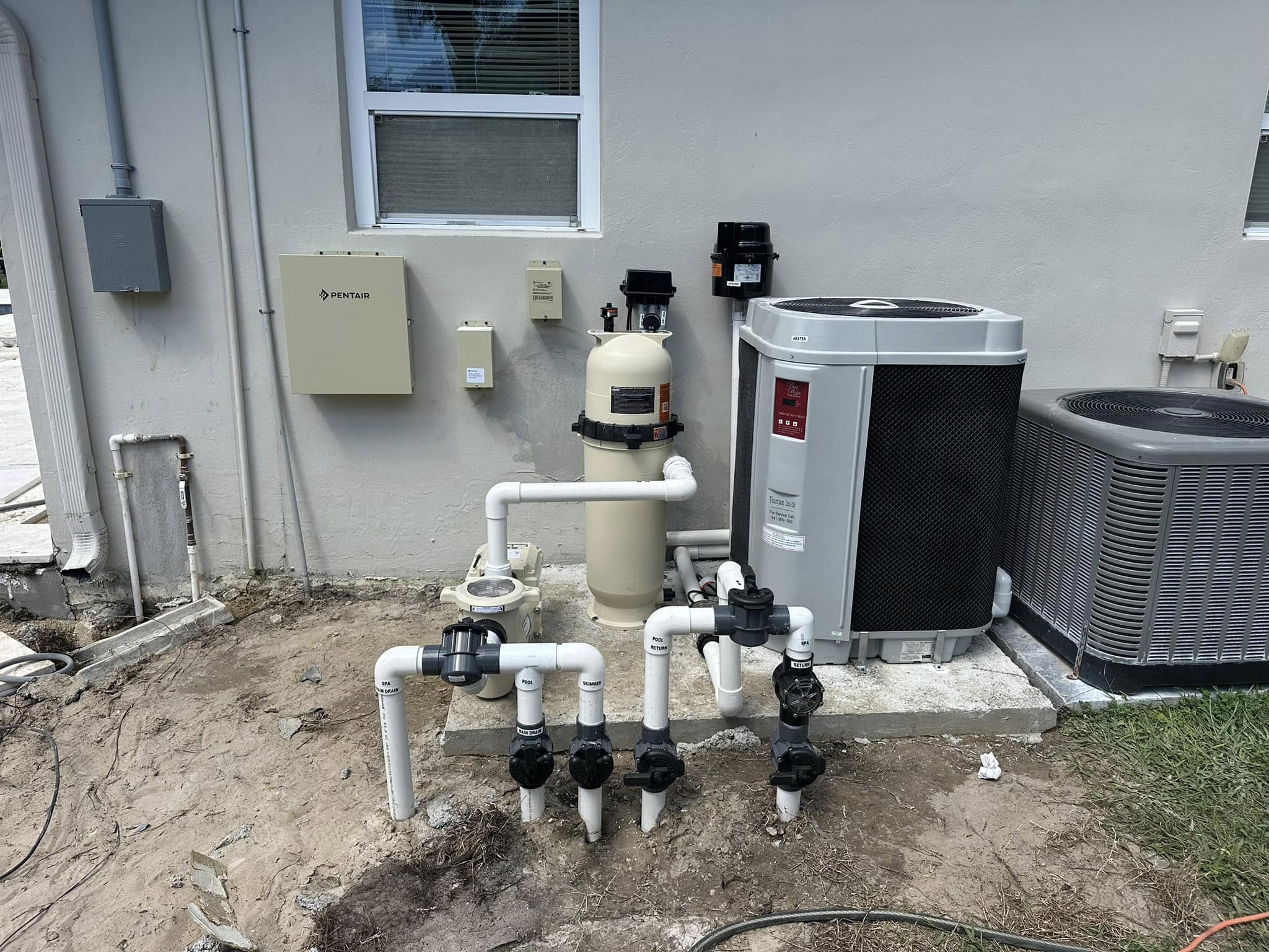 Pool heat pump and heater installation on an equipment pad in Fort Myers
