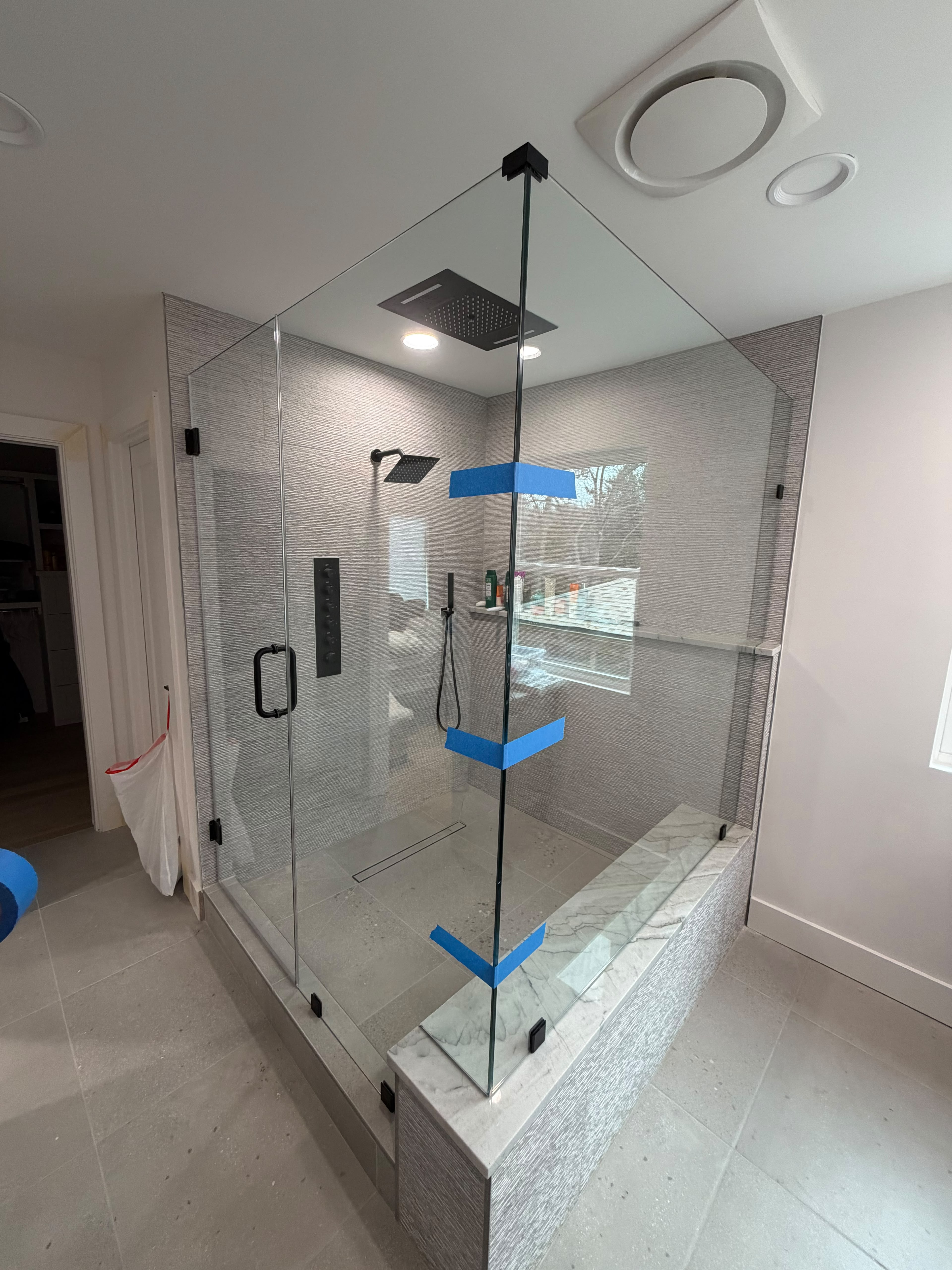 Custom matte black frameless corner glass shower enclosure