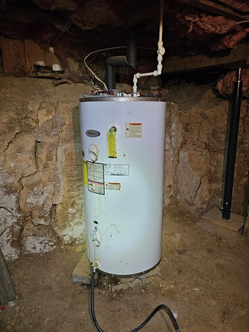 Old water heater draining before replacement in Bluff City, TN