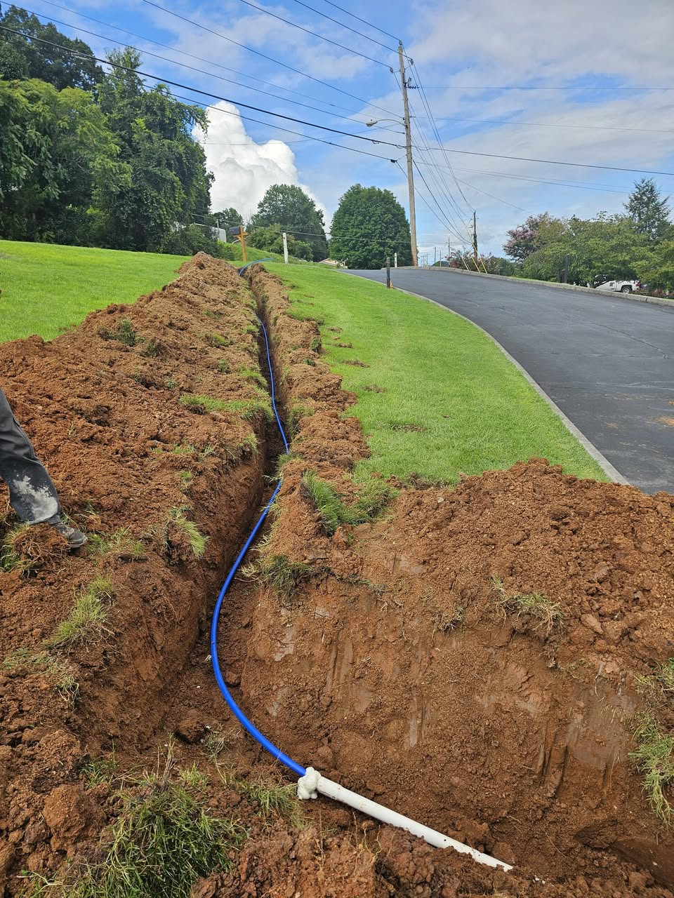New blue water line laid in trench at Emmaus Church in Kingsport, TN