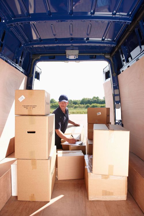 American Pride crew loading stacked boxes into a moving truck