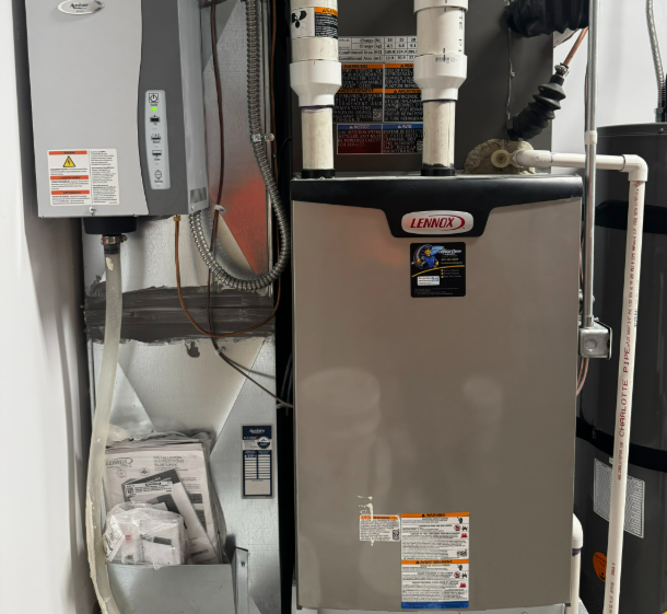 Lennox gas furnace and AprilAire humidifier system installed in residential utility room