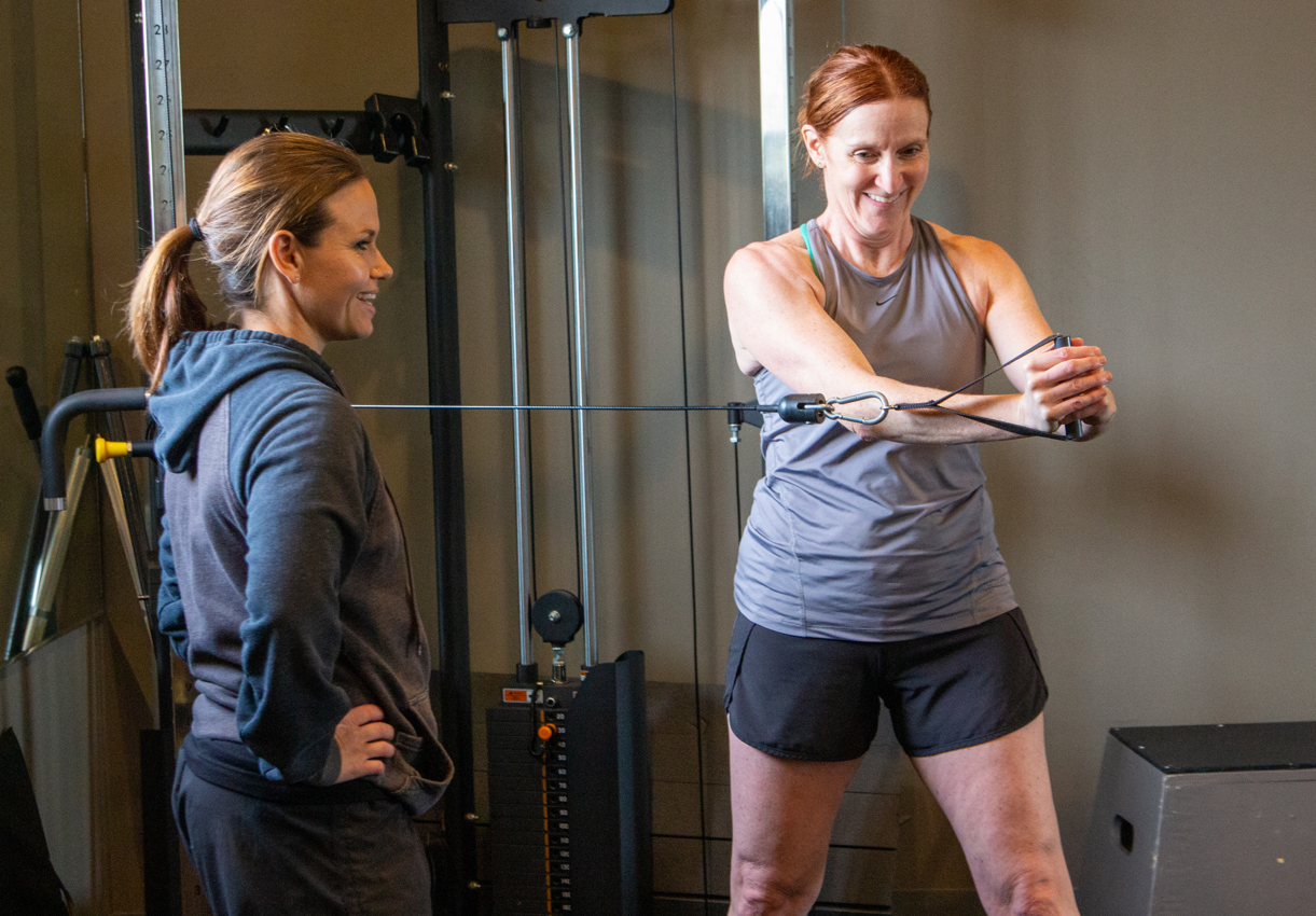 Woman exercising with personalized coaching at 360 Fitness Red Deer