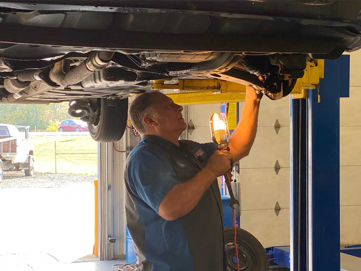 Feldman Auto Center technician working on a vehicle in Greensburg, Indiana
