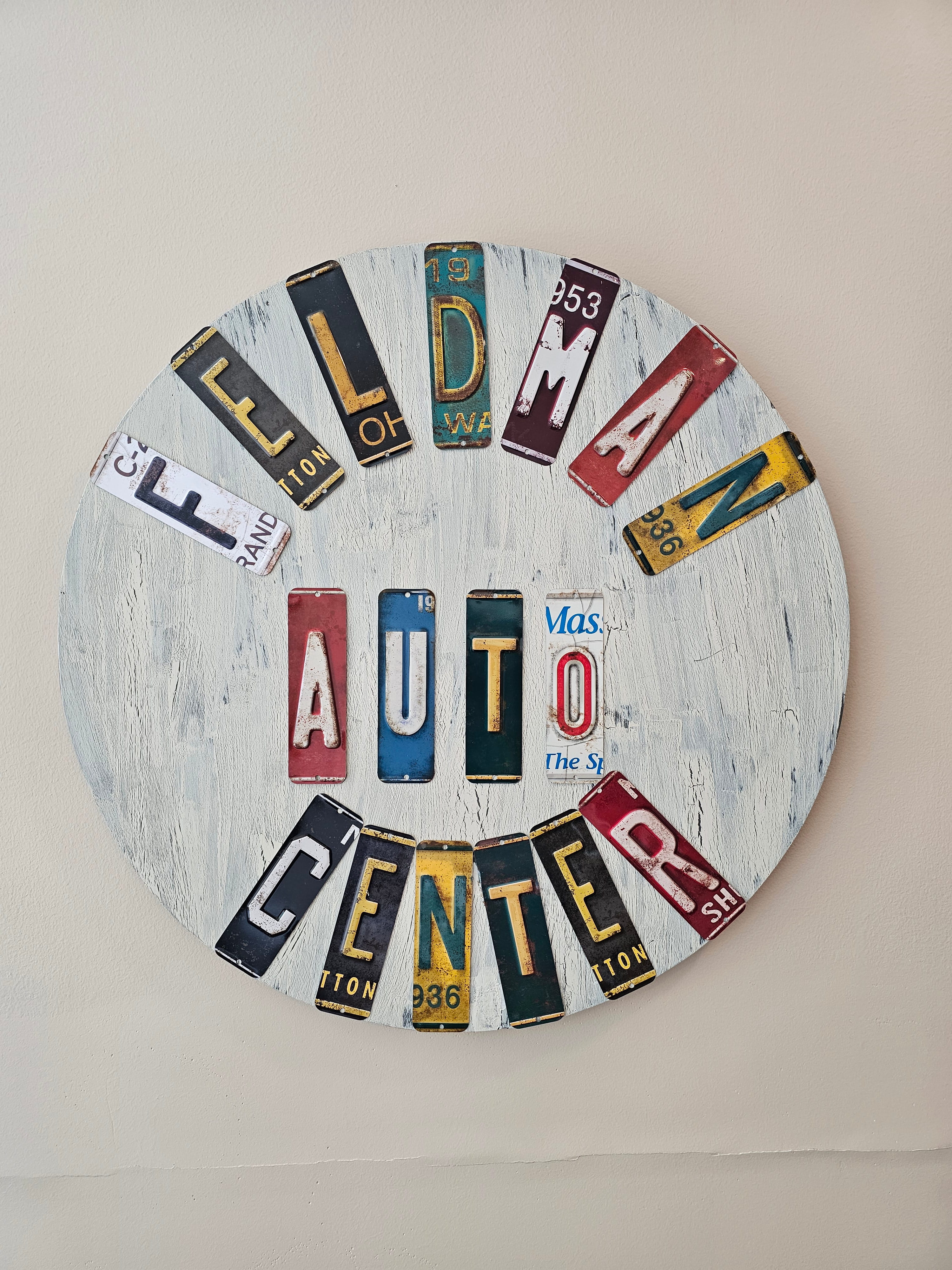 Custom license plate Feldman Auto Center wall sign