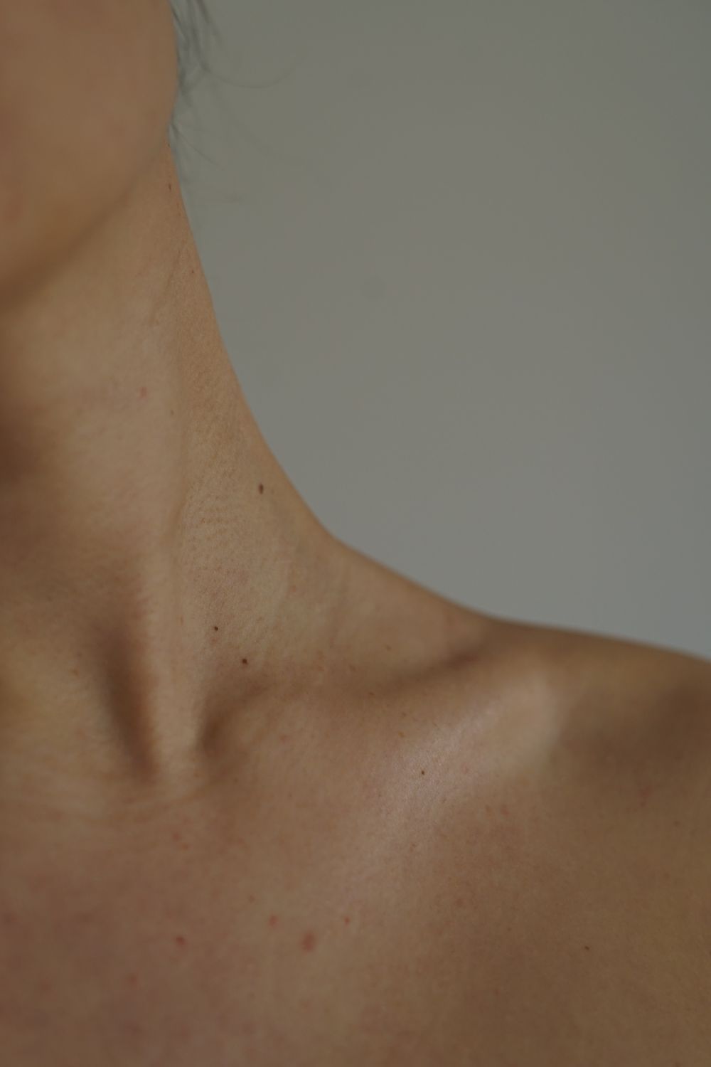 Editorial detail of the neck and collarbone.
