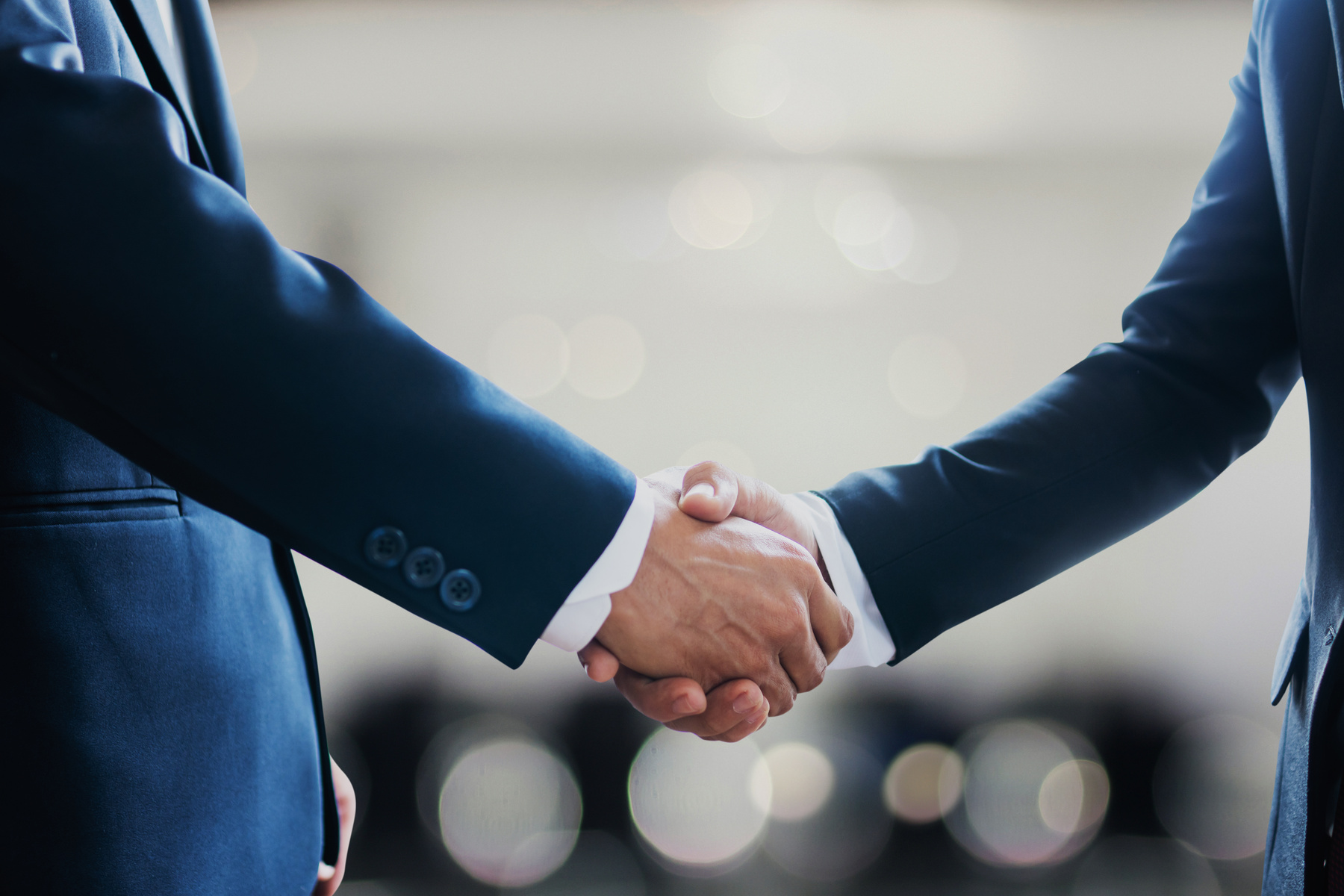Professional consultation handshake between legal counsel and client