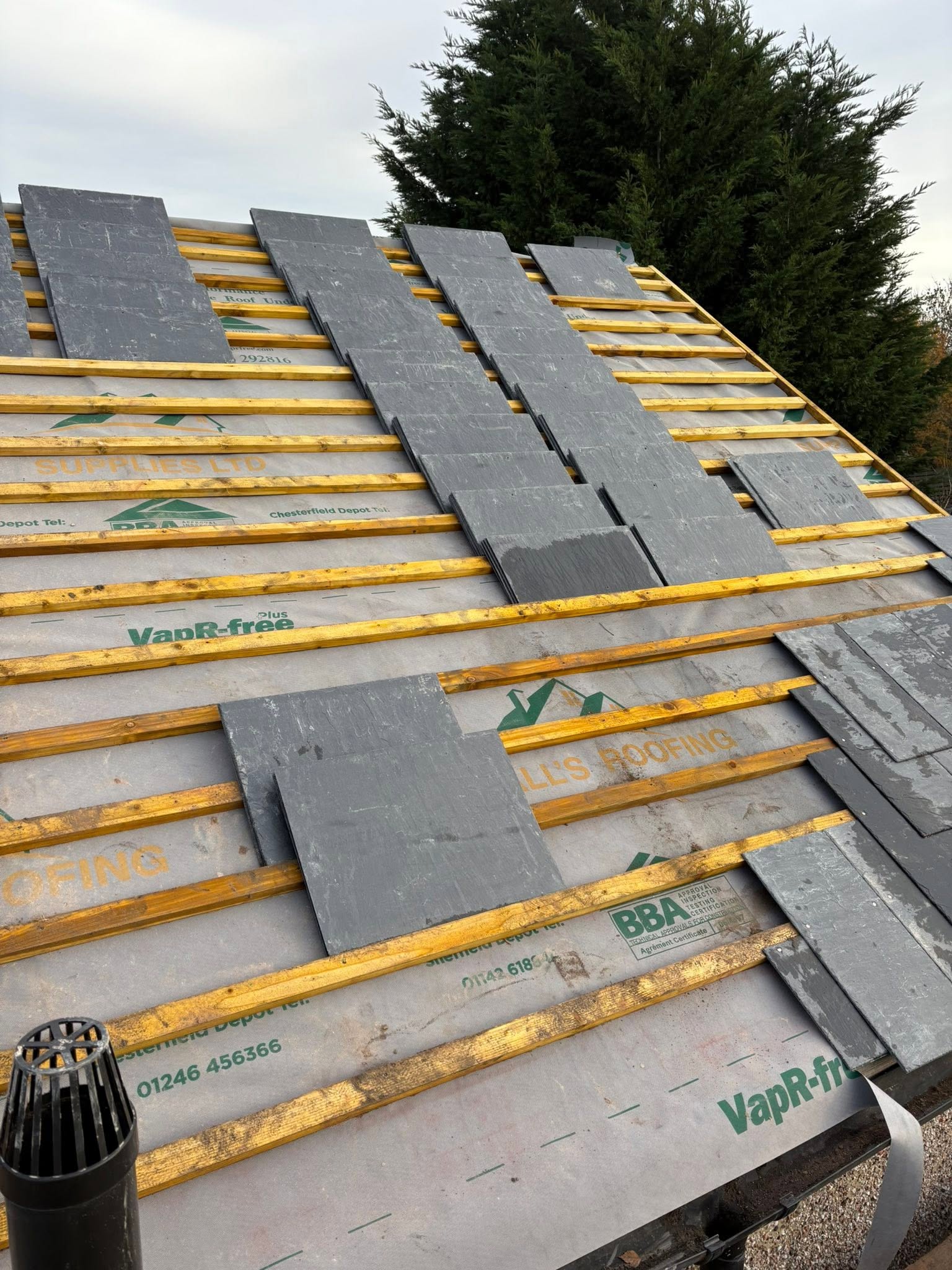 S.A.G Roofing Bristol team laying tiles on a Bristol roof