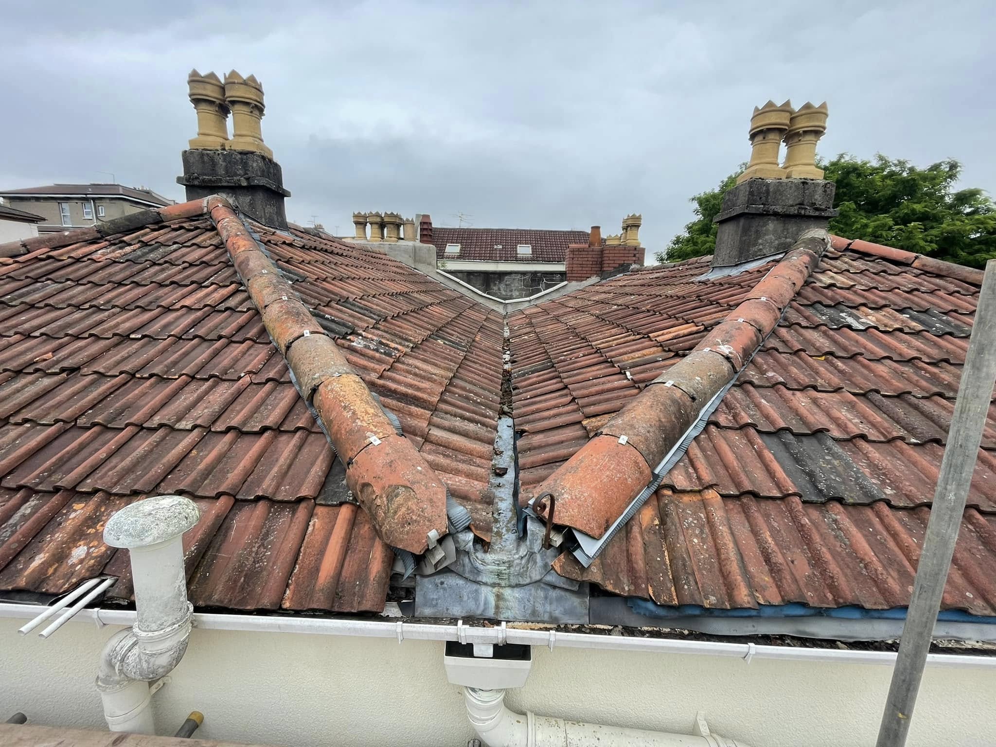 Before: Fractured hip ridges, perished valley lining and debris accumulation causing leaks.