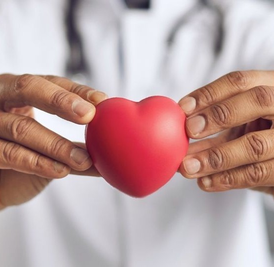 Healthcare professional holding heart - compassionate care