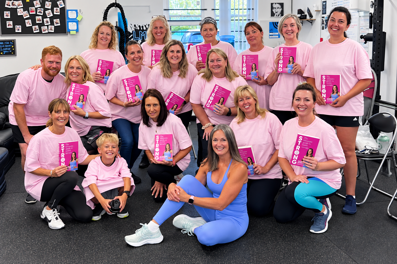 LukeMurray.Fit members together in the studio wearing pink shirts