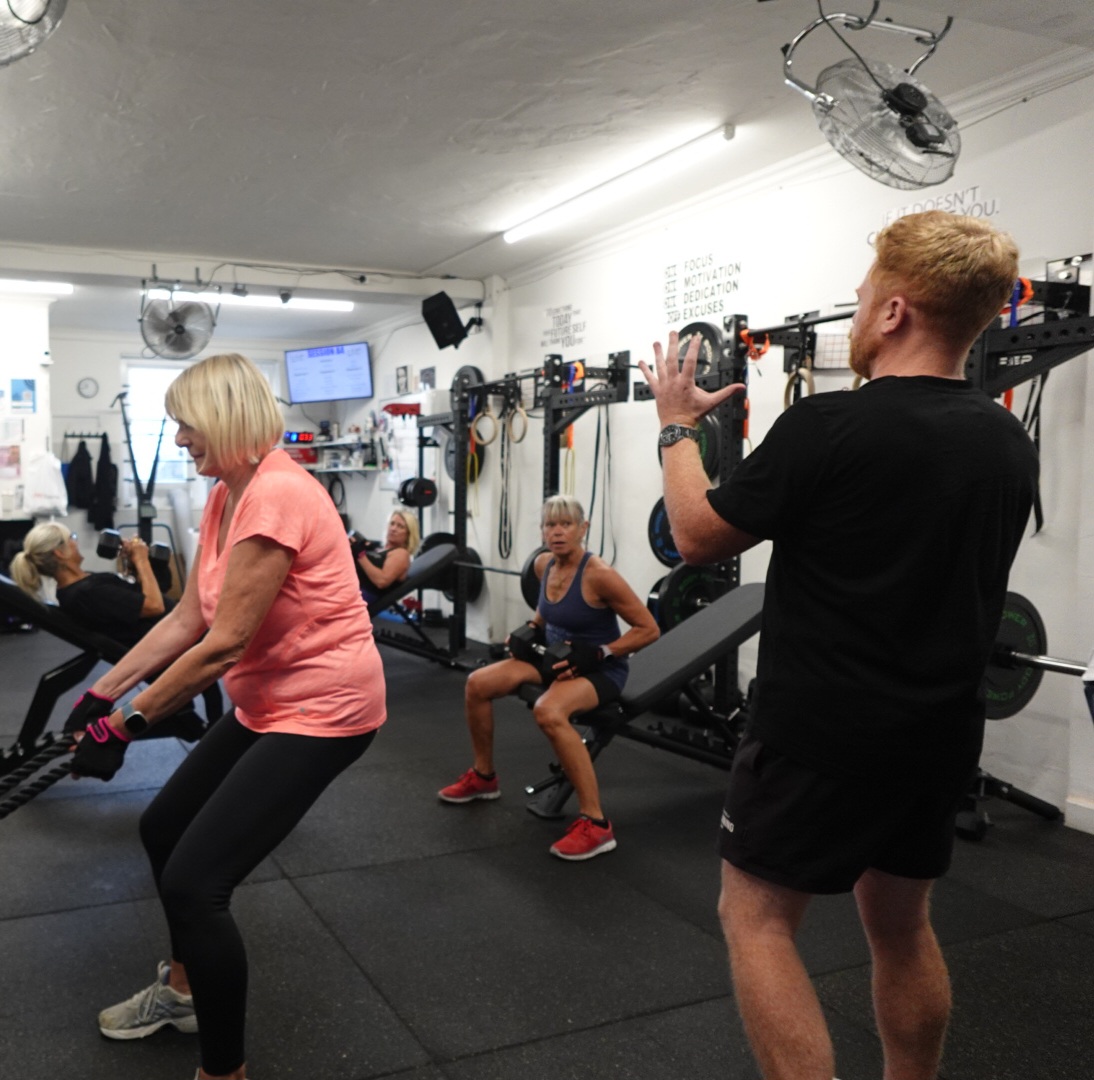 Personal trainer Luke coaching a member during a strength session at LukeMurray.Fit