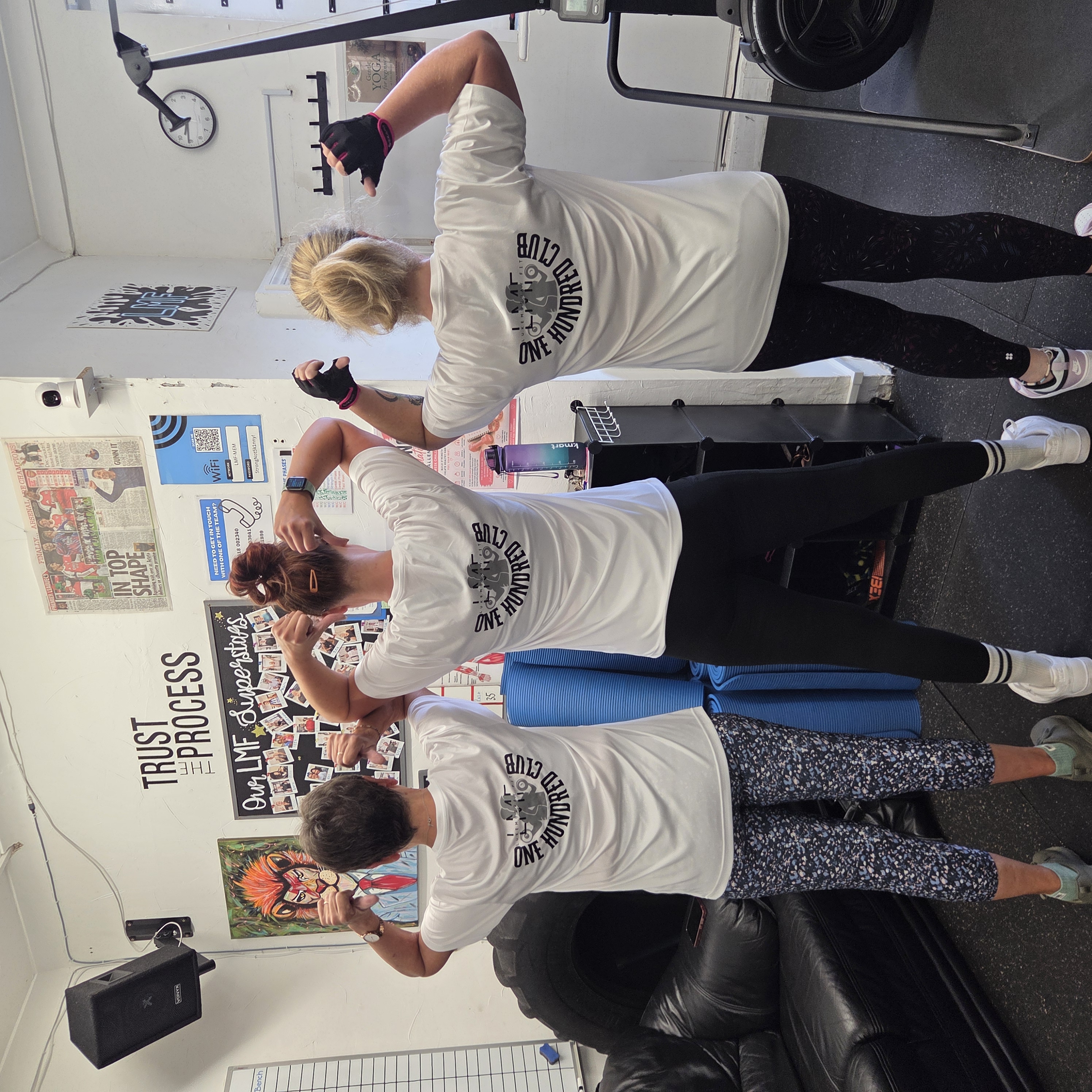 LukeMurray.Fit members wearing One Hundred Club shirts in the studio