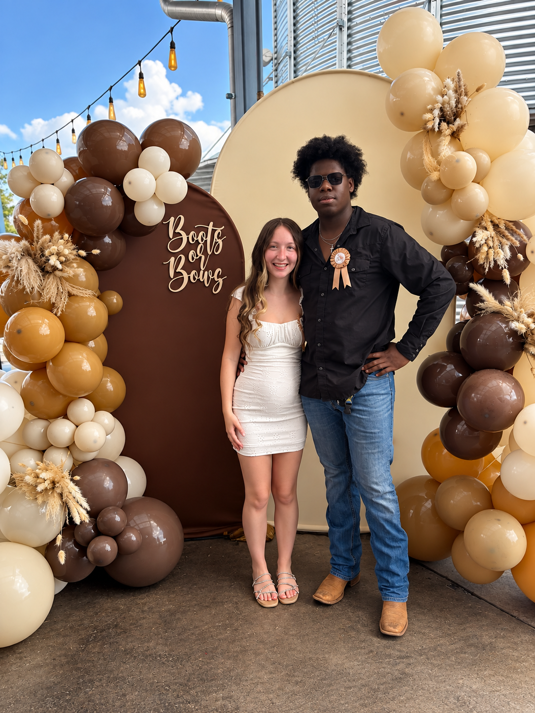 The Expecting Parents at the Custom Backdrop