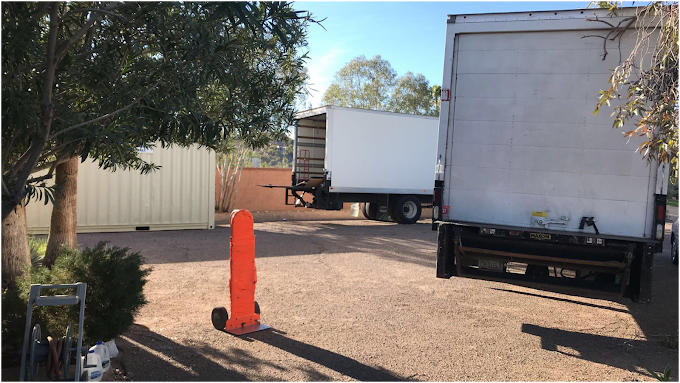 The Moving Guy moving trucks and loading staging area