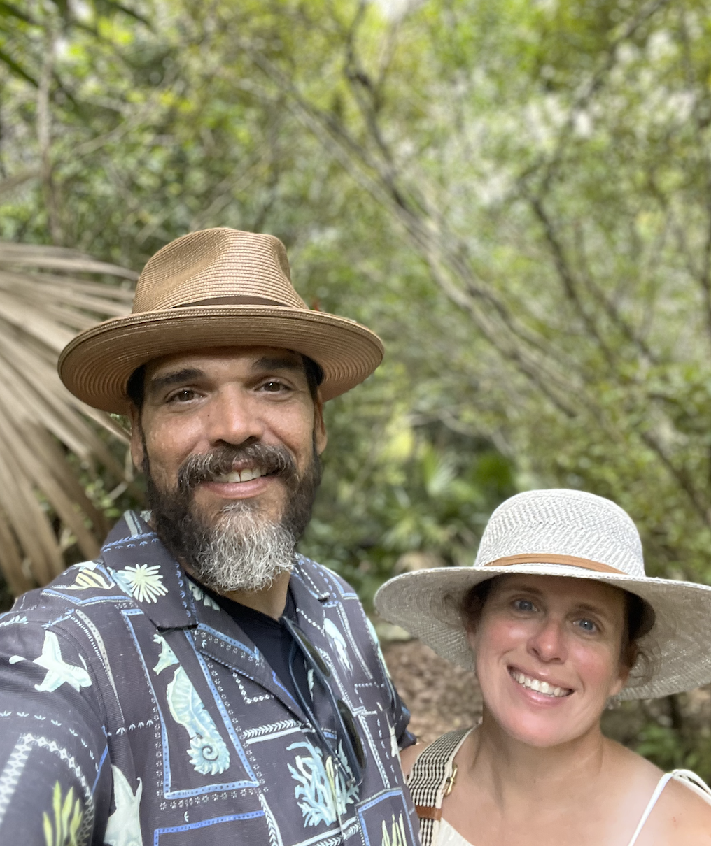 Joshua McGuire with his wife outdoors, smiling warmly