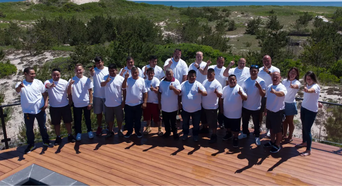 The Custom Island Homes crew and trade partners on a completed rooftop deck on the East End of Long Island