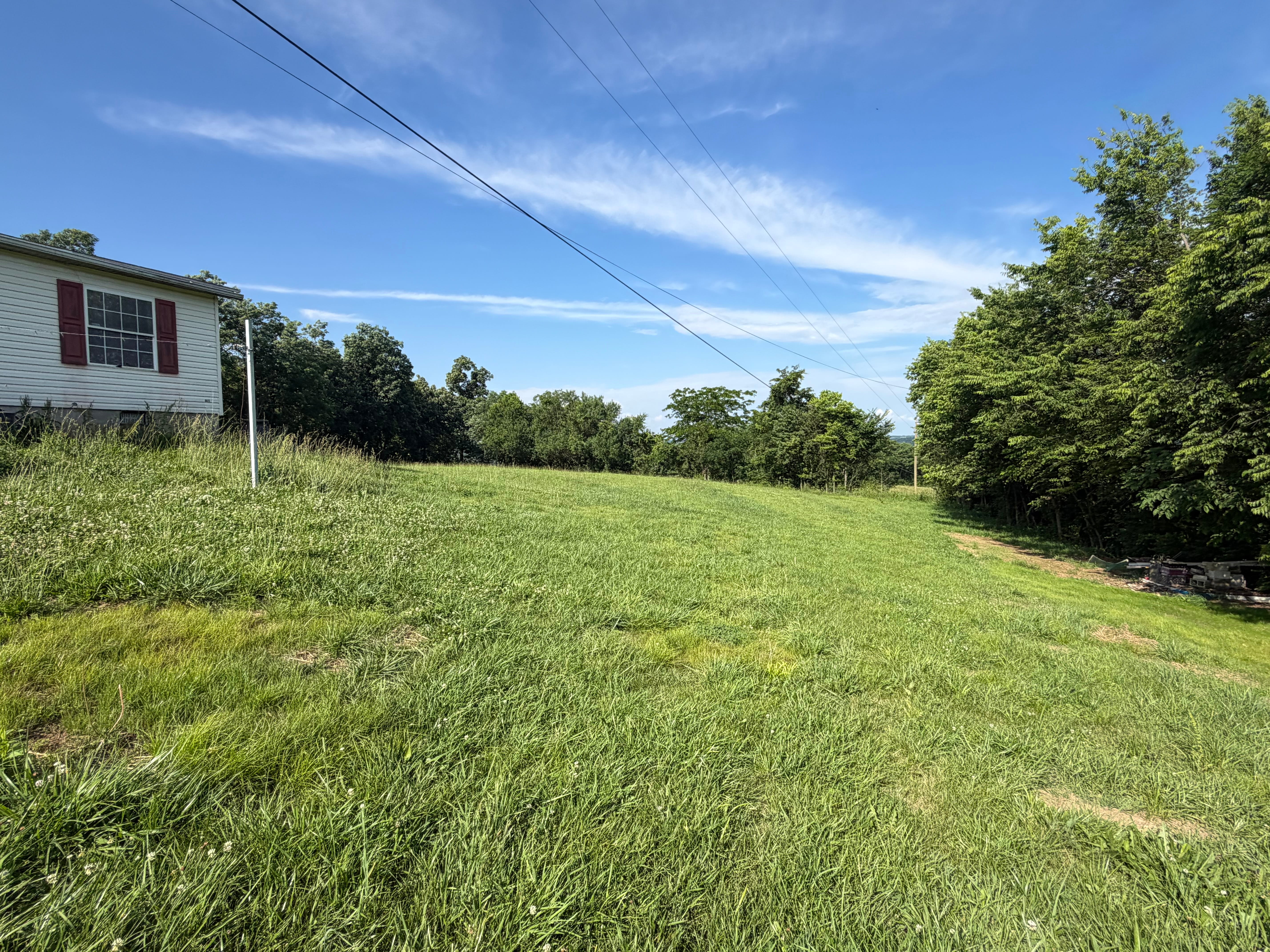 Freshly graded, smooth leveled yard and driveway site by RR Property Solutions