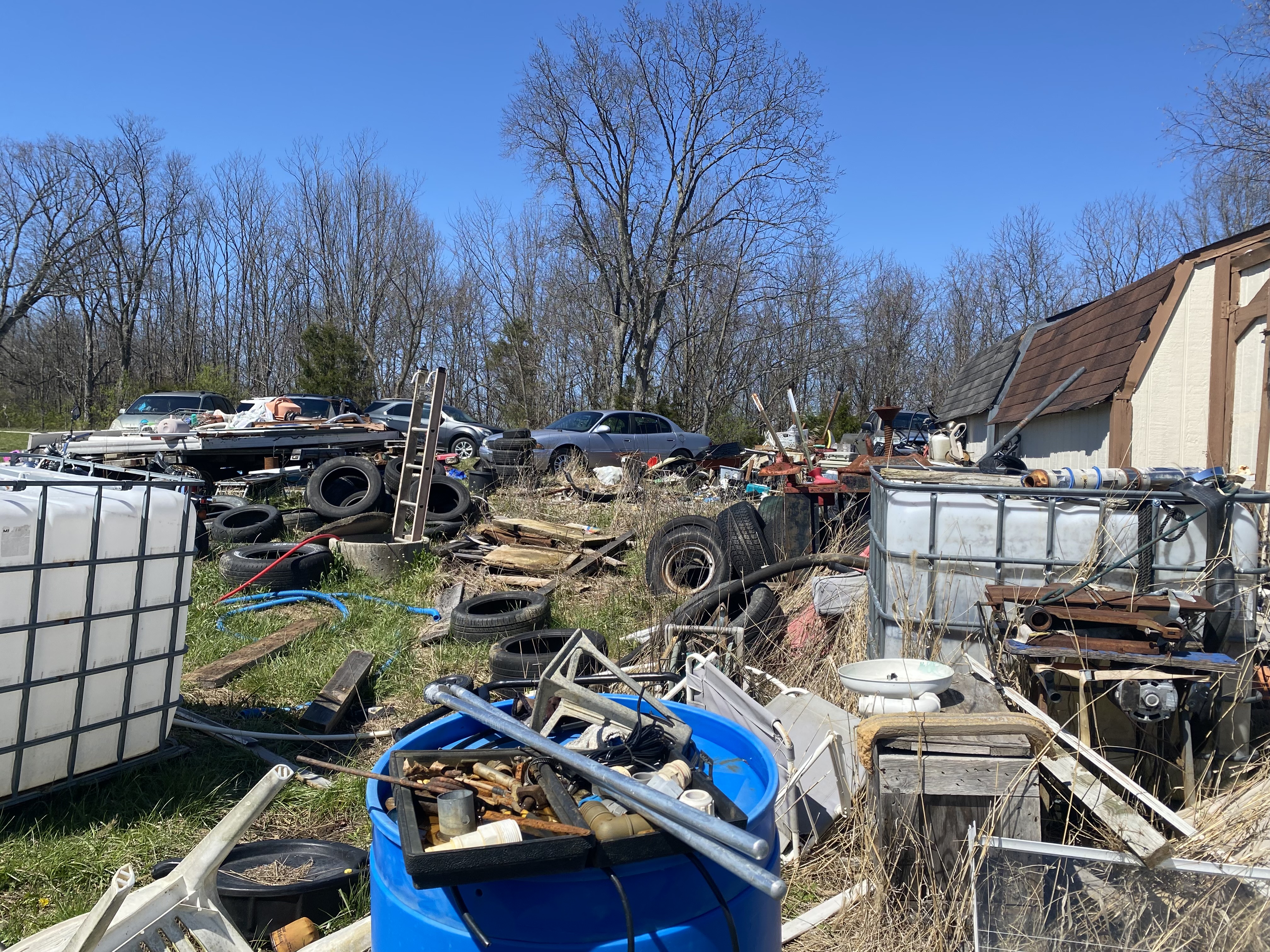 RR Property Solutions loading and hauling off heavy root piles and debris