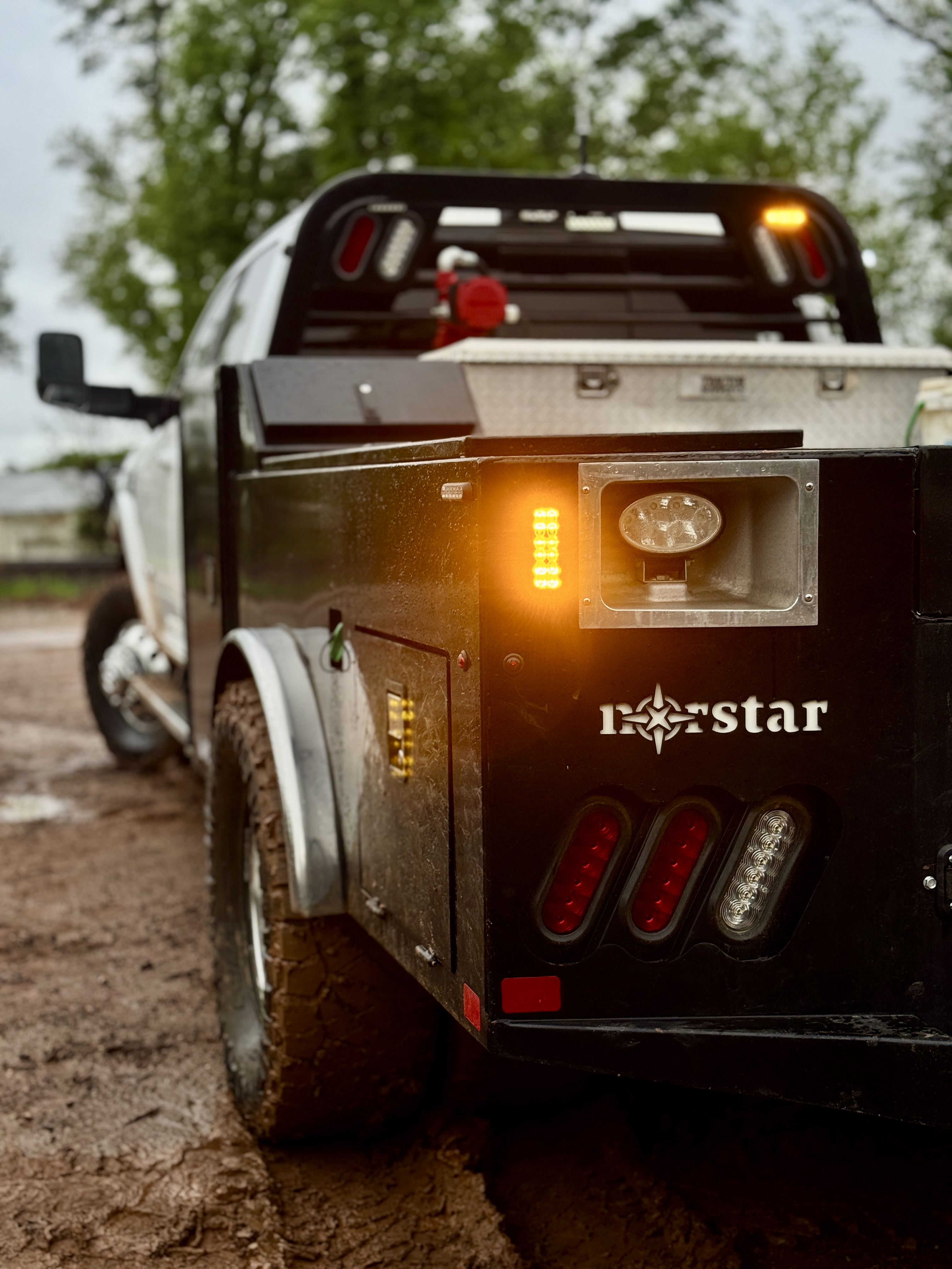 Norstar utility service body with custom amber LED perimeter strobes, headache rack lights, and work lighting wiring