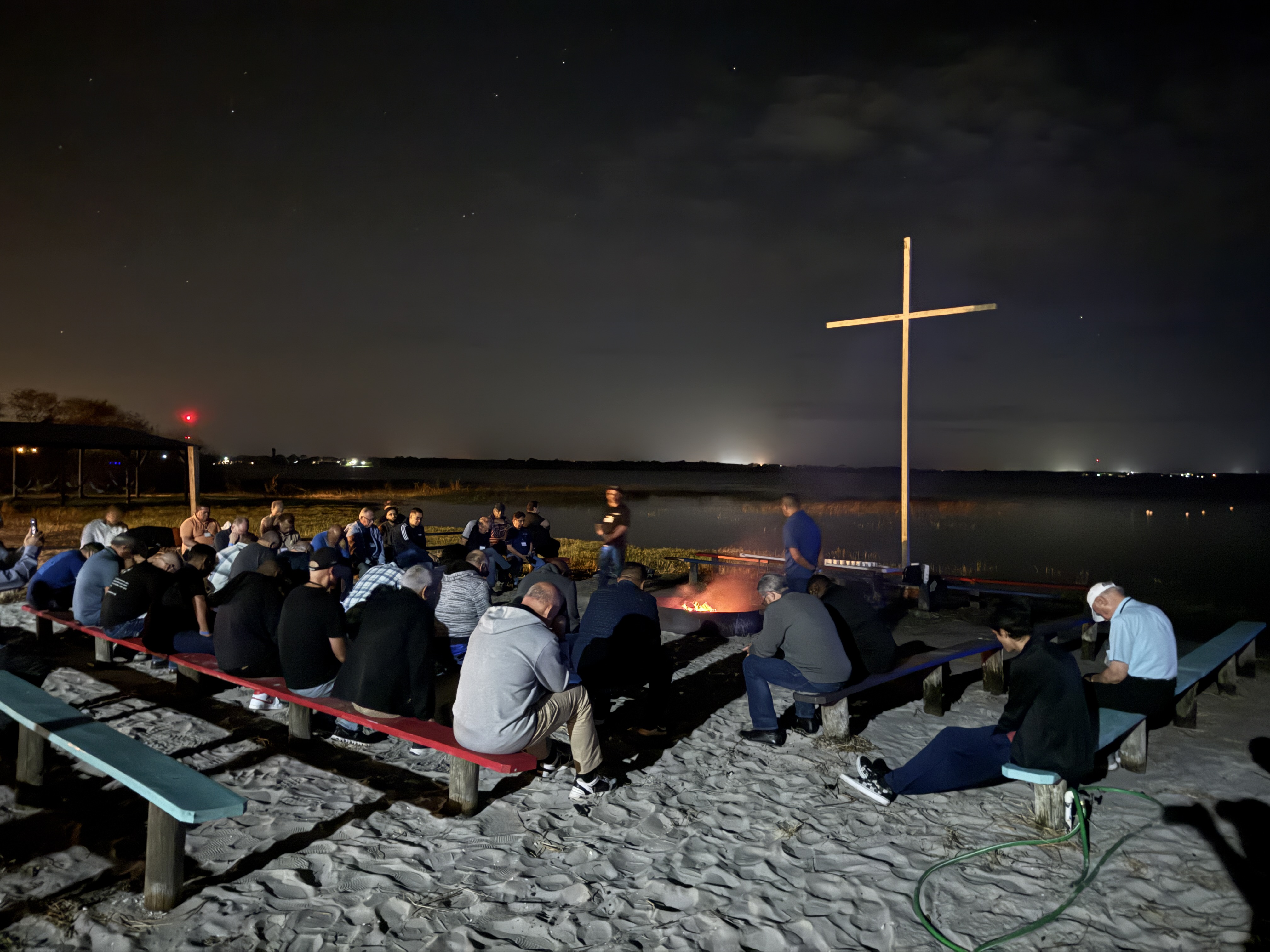 Night vigil and lakeside campfire prayer around the cross at Lake Placid