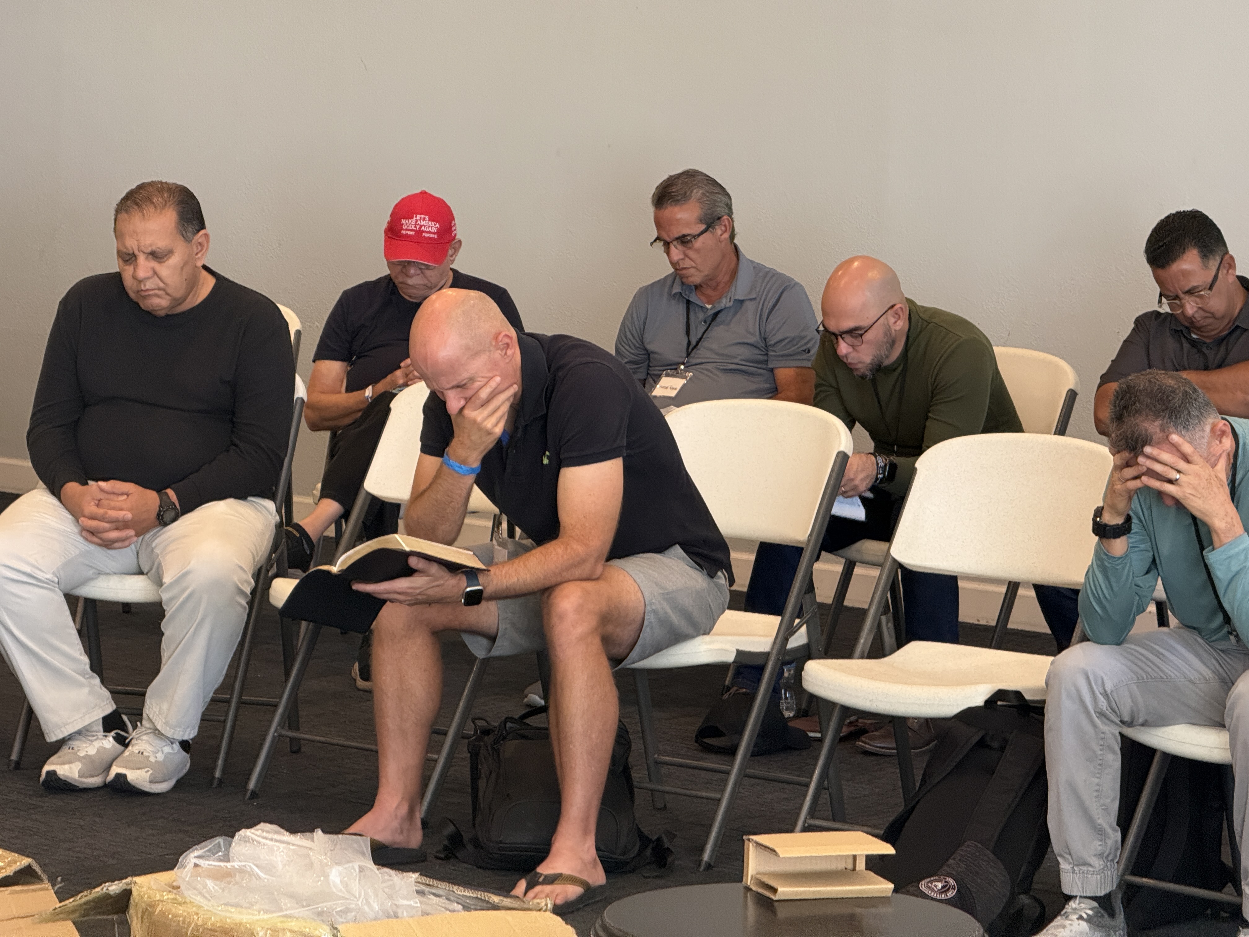 Seated prayer group at the Consecration Prayer Summit