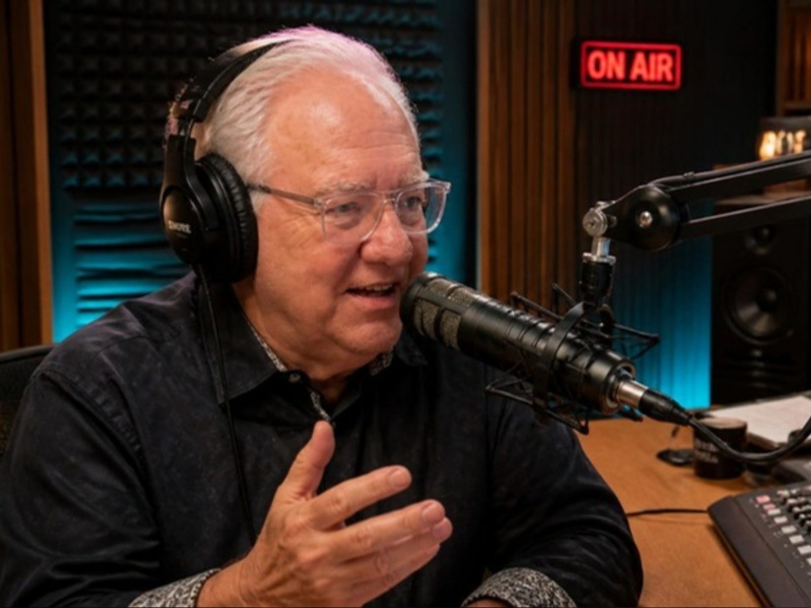 Paul Chargois at the microphone in his studio