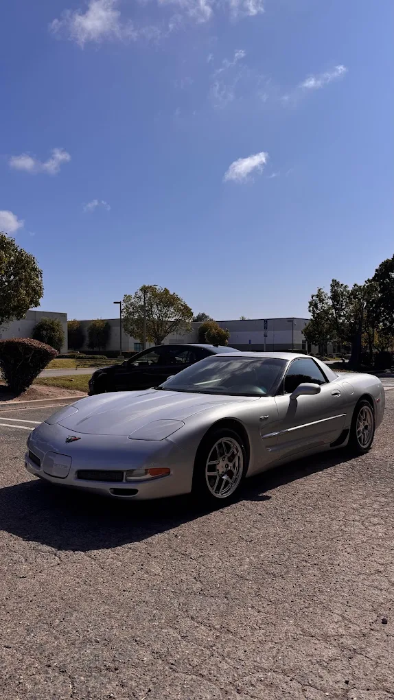 Silver Chevrolet Corvette Z06 completed body repair and mirror clearcoat delivery