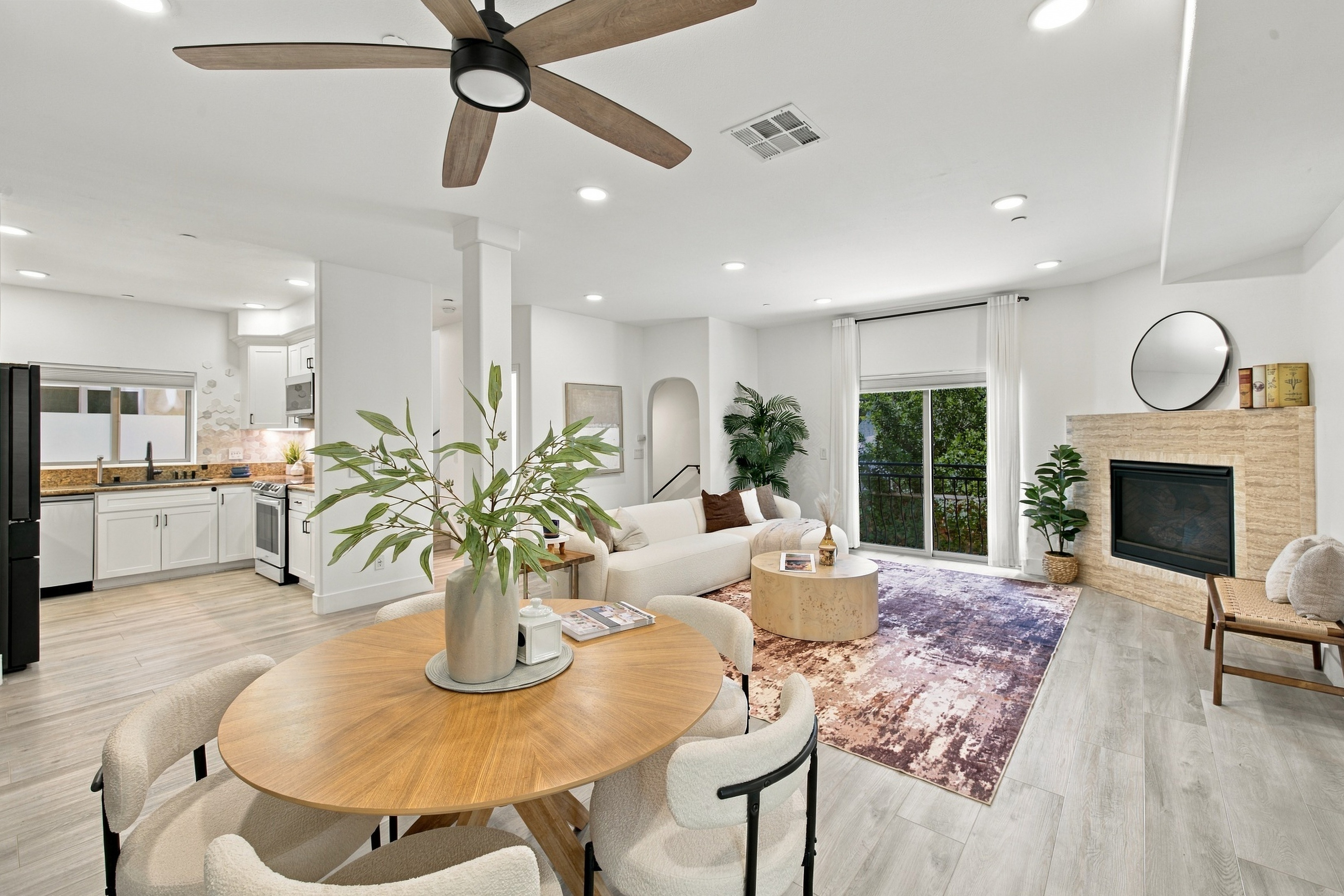 Updated living room interior with contemporary fireplace and balcony