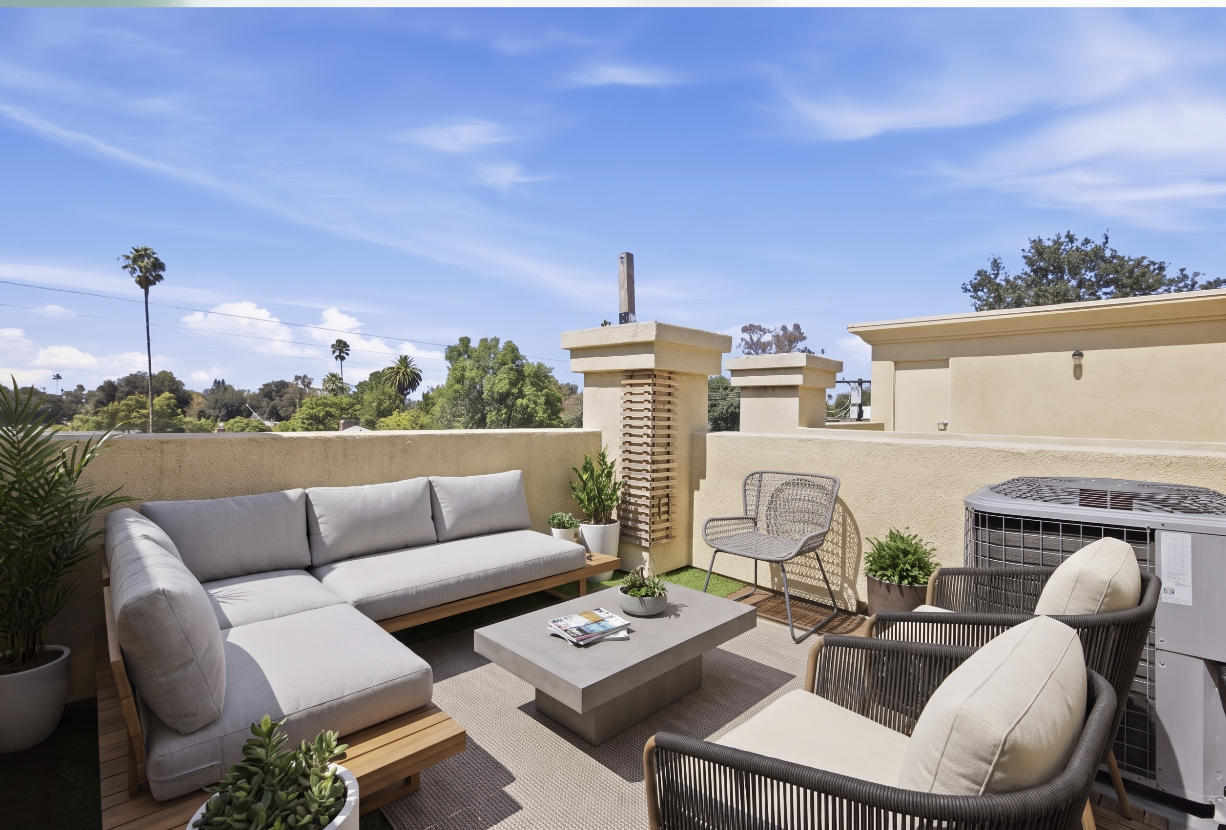 Spacious private rooftop courtyard with lounge seating
