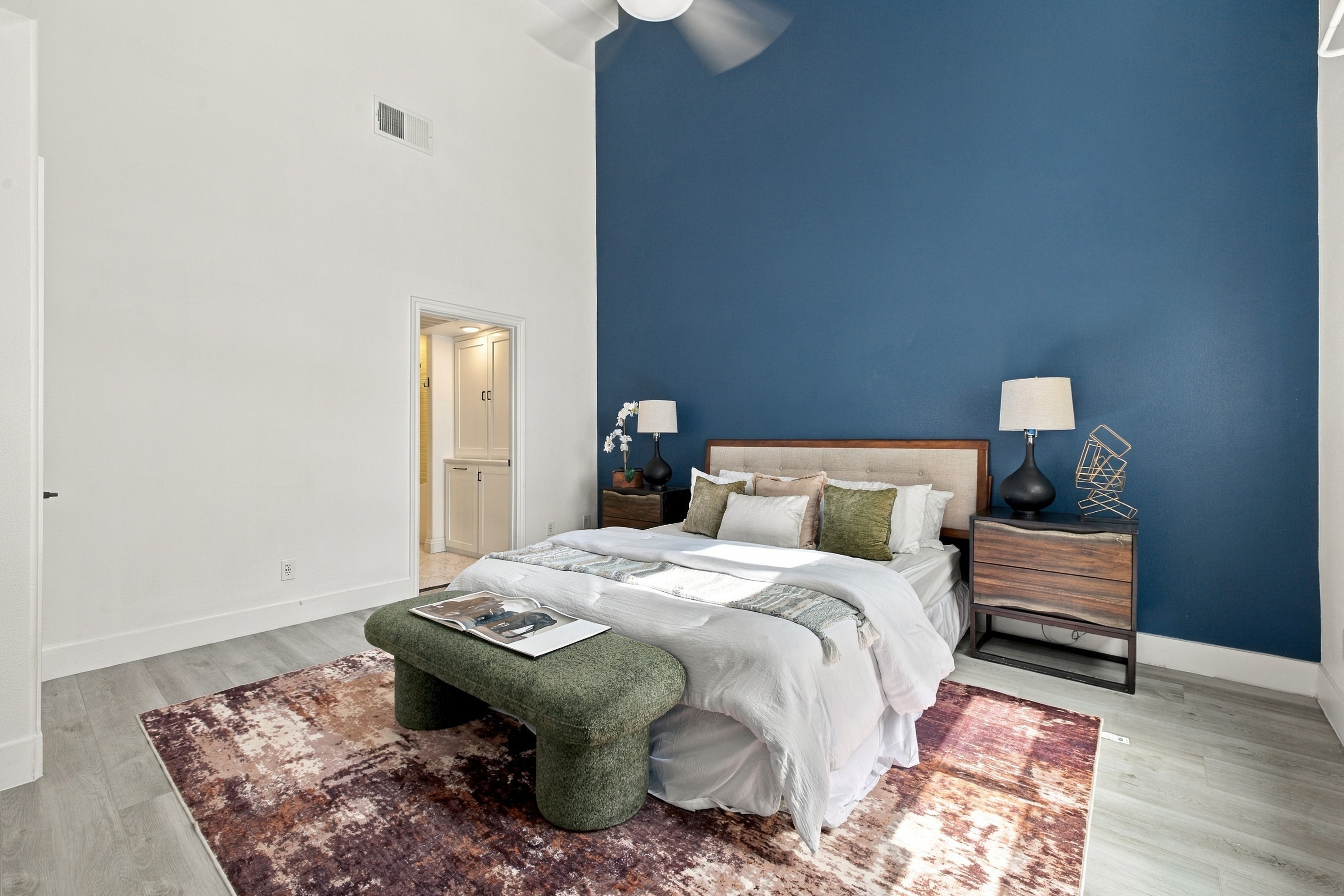 Primary bedroom retreat featuring high ceilings and picture windows