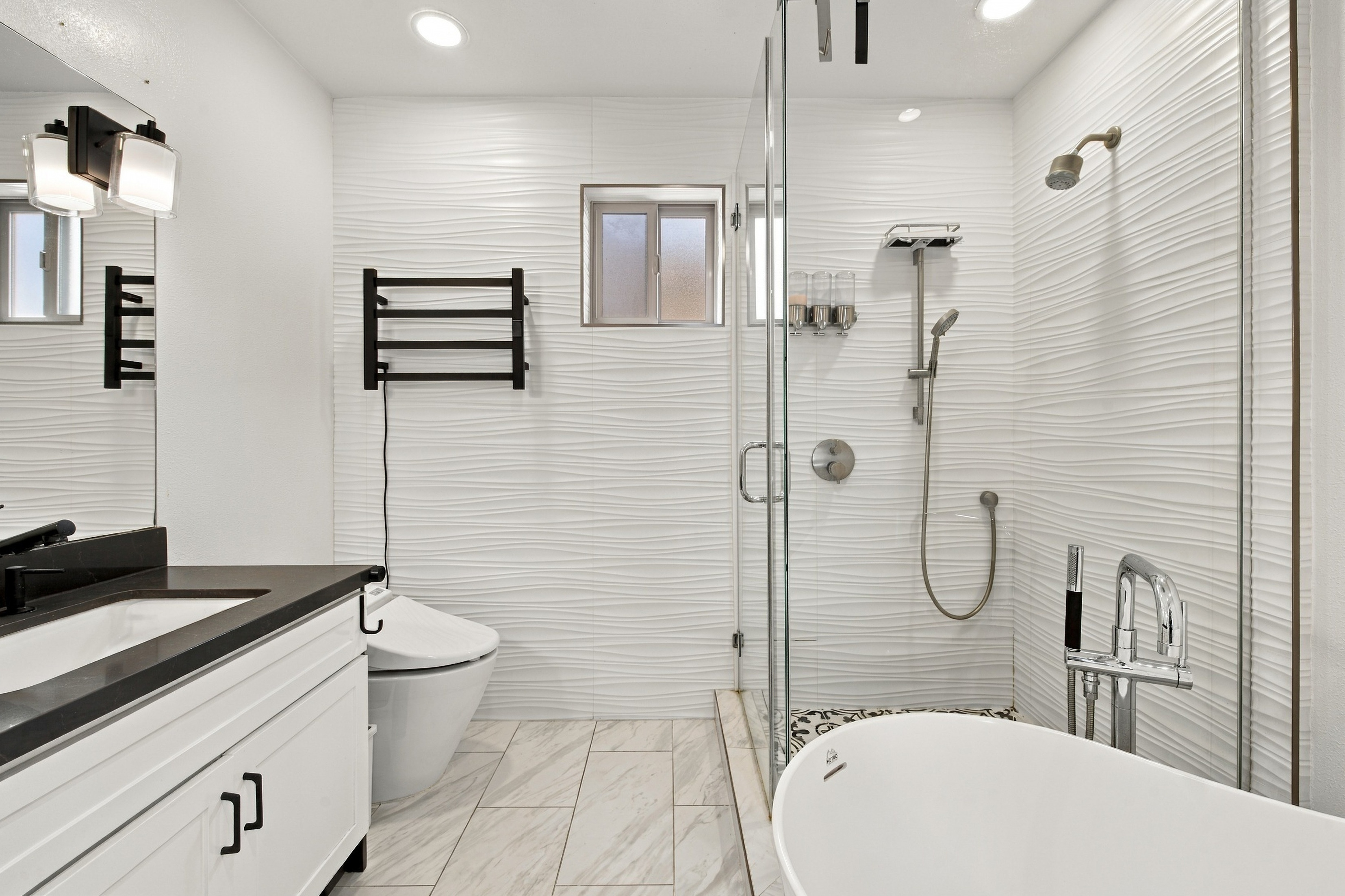 Luxurious spa bath with freestanding soaking tub and textured wall