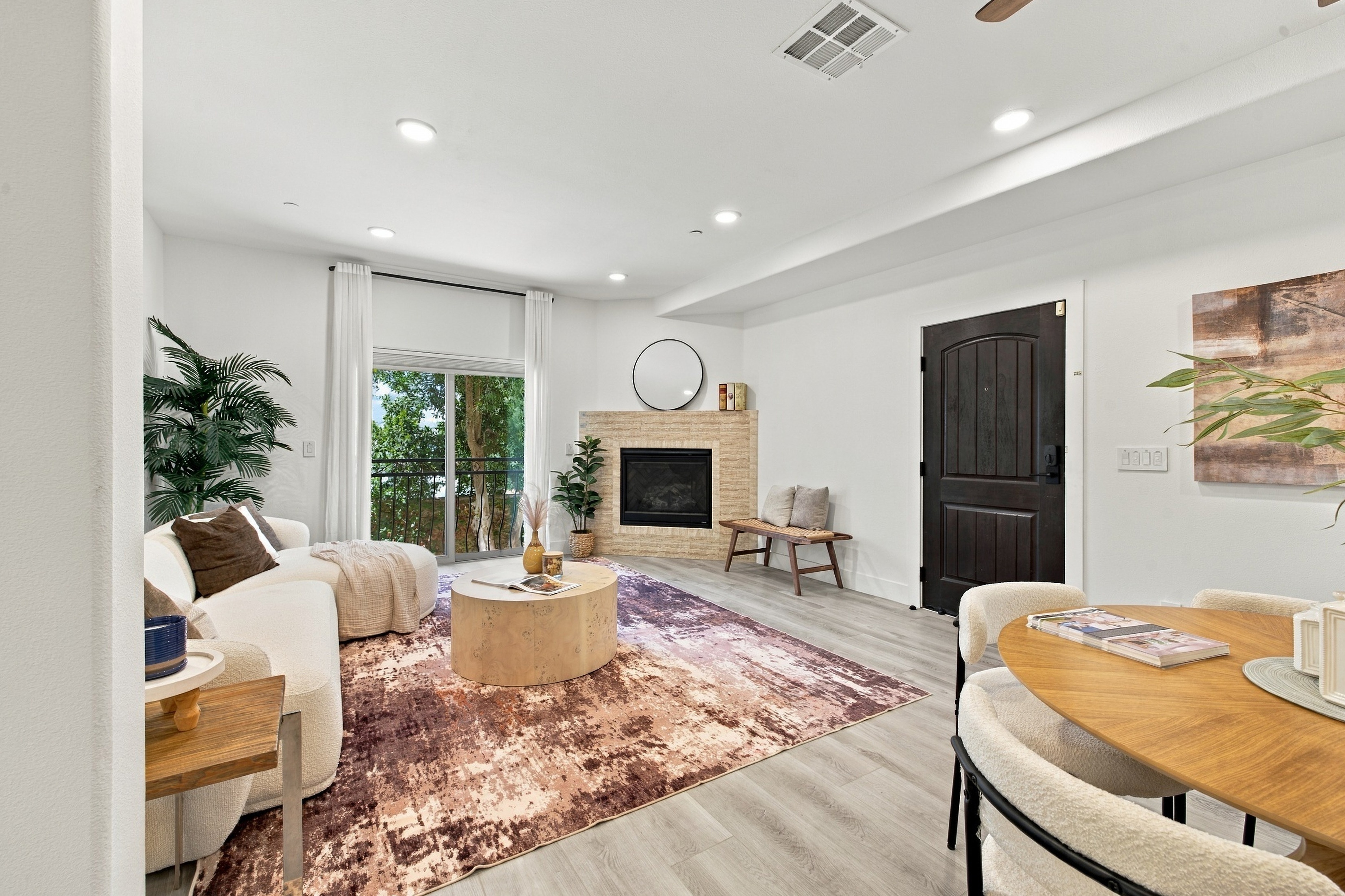 Living room showing patio glass doors and custom finishes