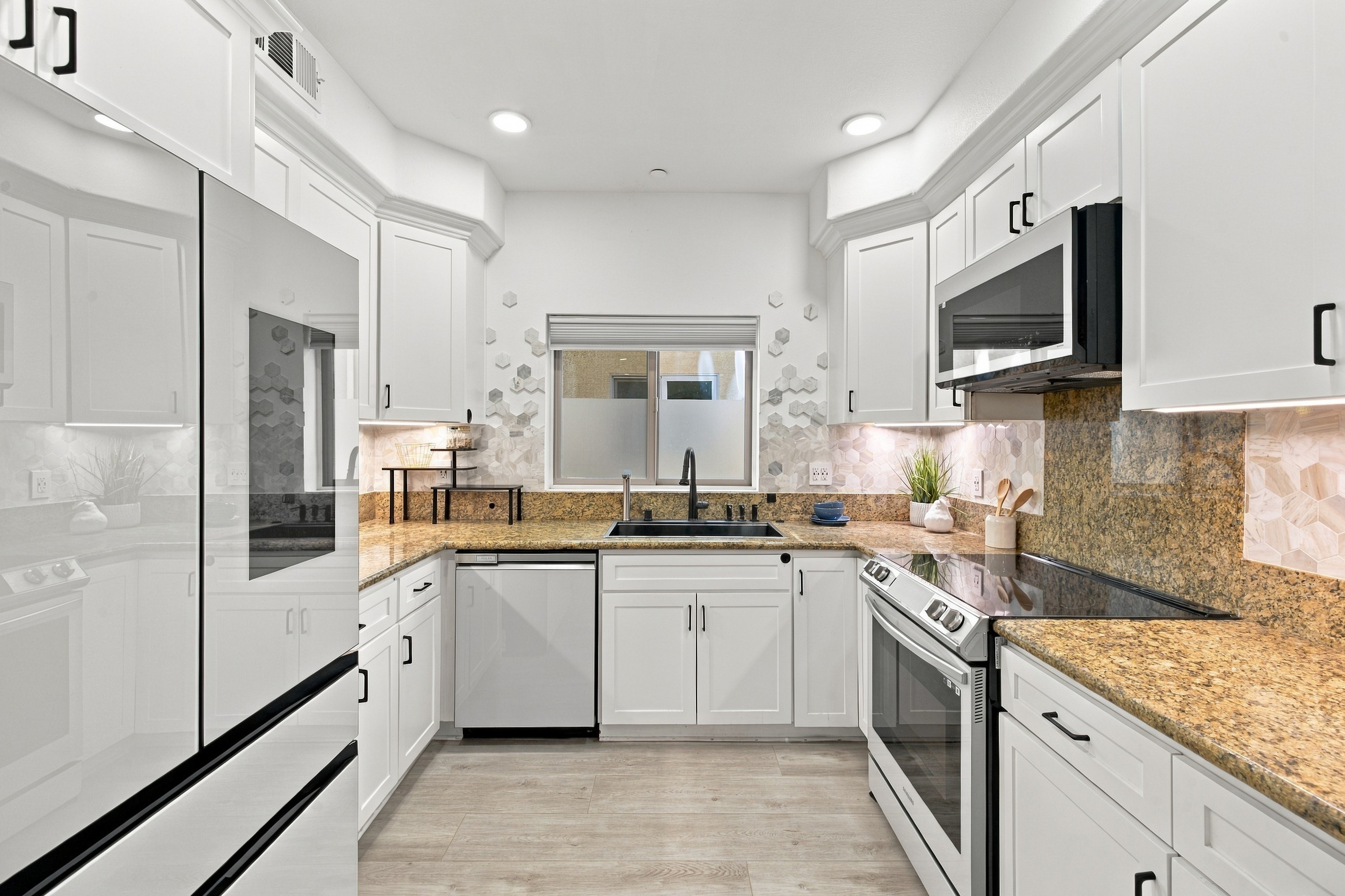 Modern kitchen with custom cabinetry and quartz countertops