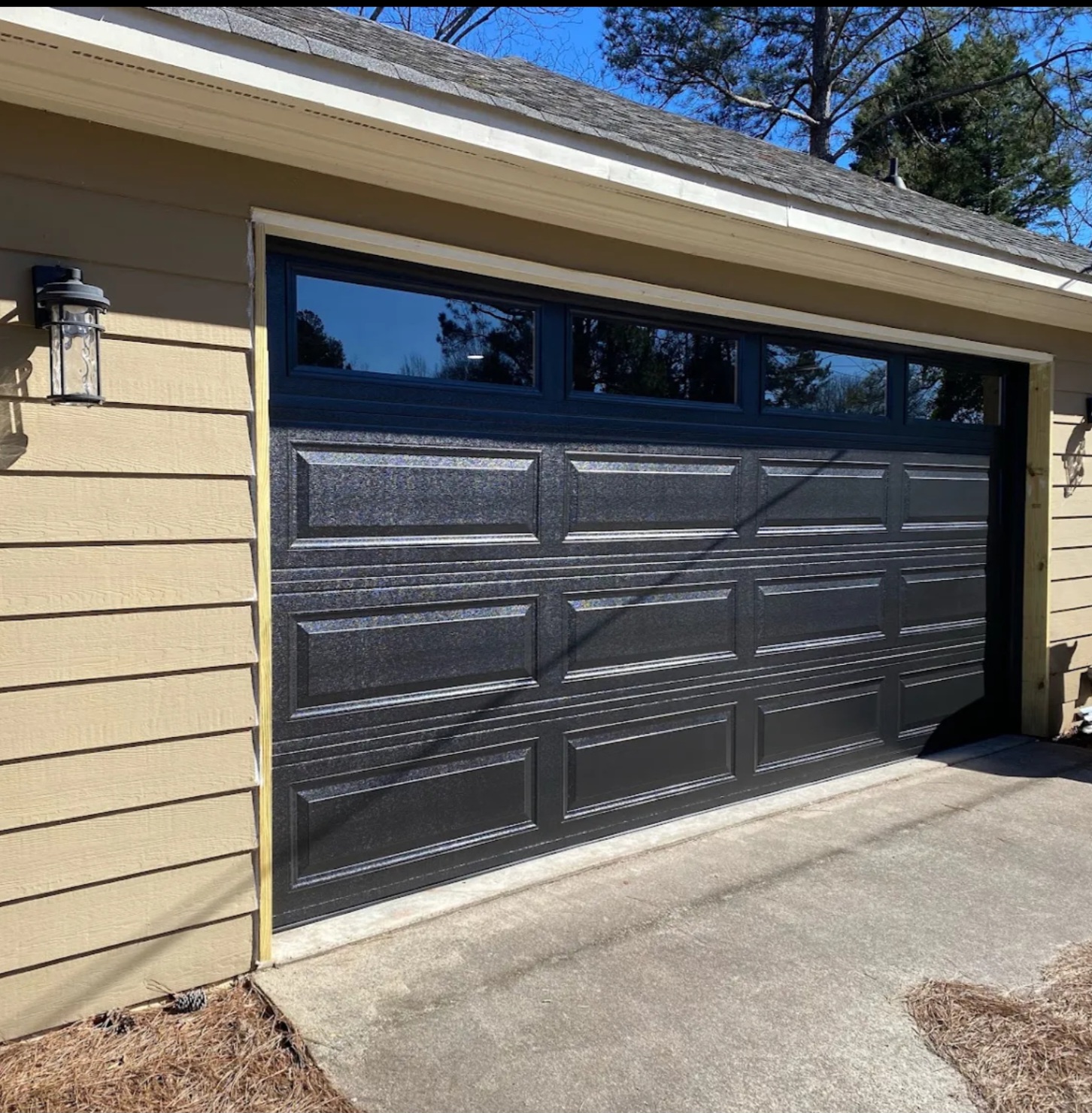 New carriage-house style garage door installed on a home in Upson County, Georgia