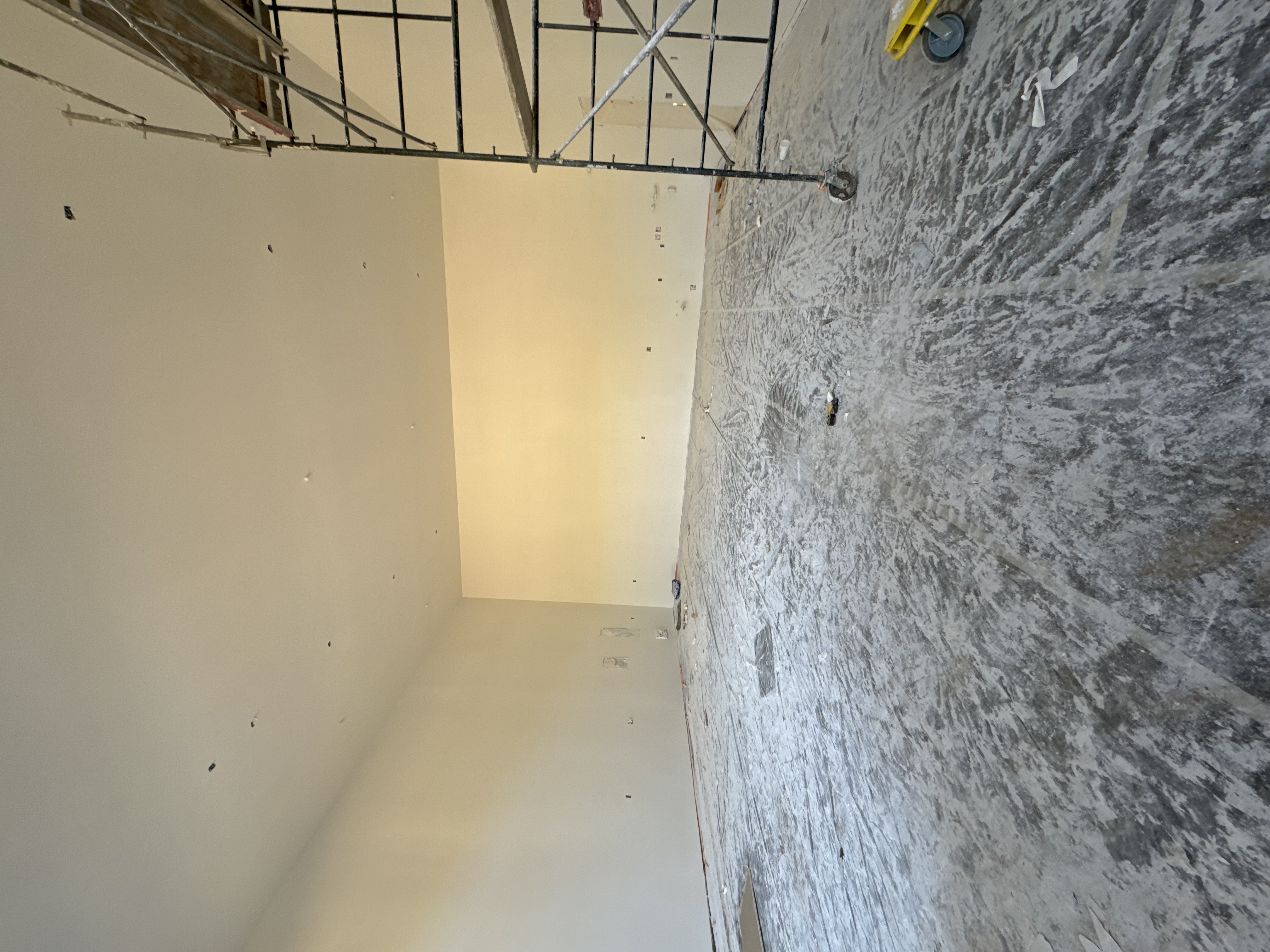 Smooth finished drywall ceiling and walls ready for prime and paint