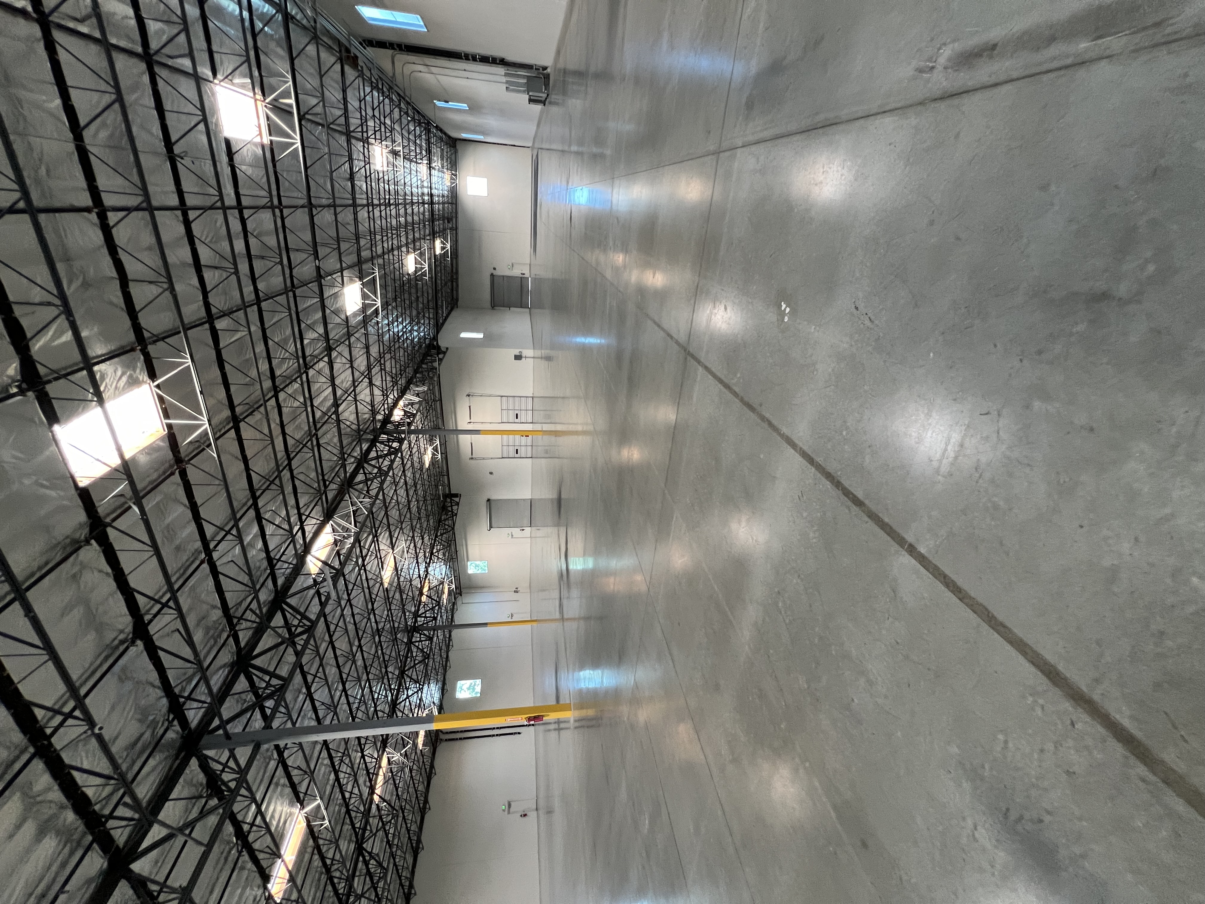 Large-scale commercial warehouse facility framing, insulation, and high-bay structure