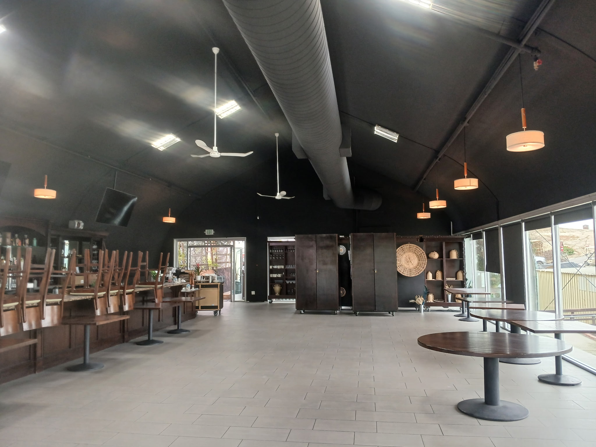 Commercial interior painting and finished black ceiling and walls for commercial venue