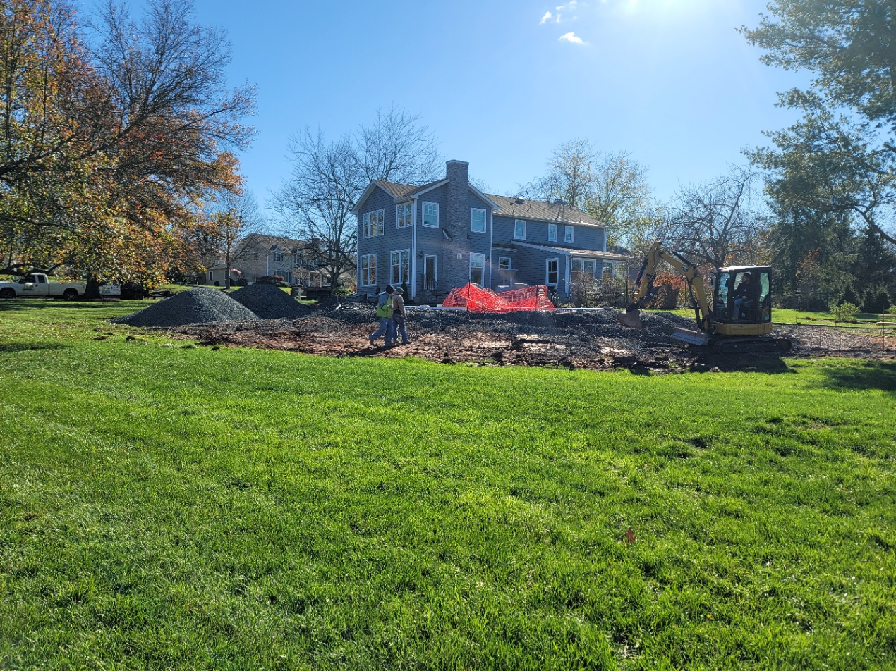 Excavator and grading for custom residential hardscape foundation