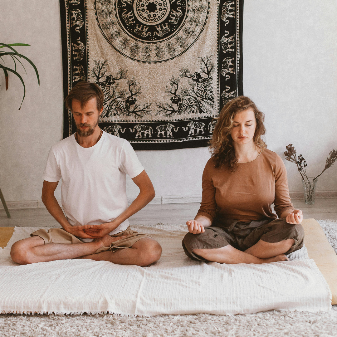 Man and woman meditating