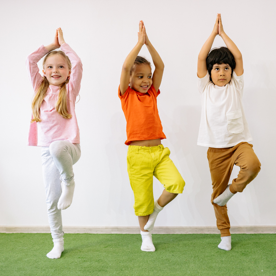 Children practicing tree pose
