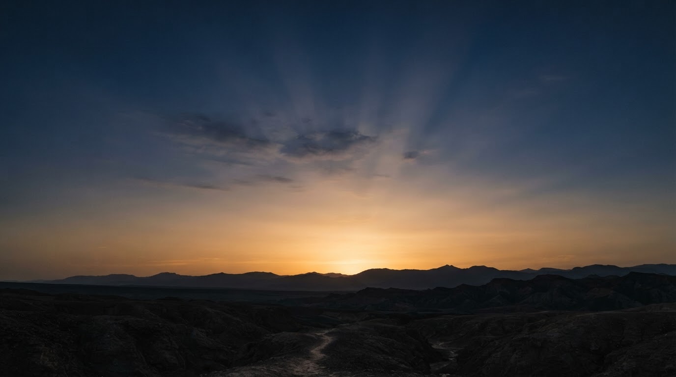 A warm dusk sky with sunlit beams breaking through clouds, representing a sky-lit concept